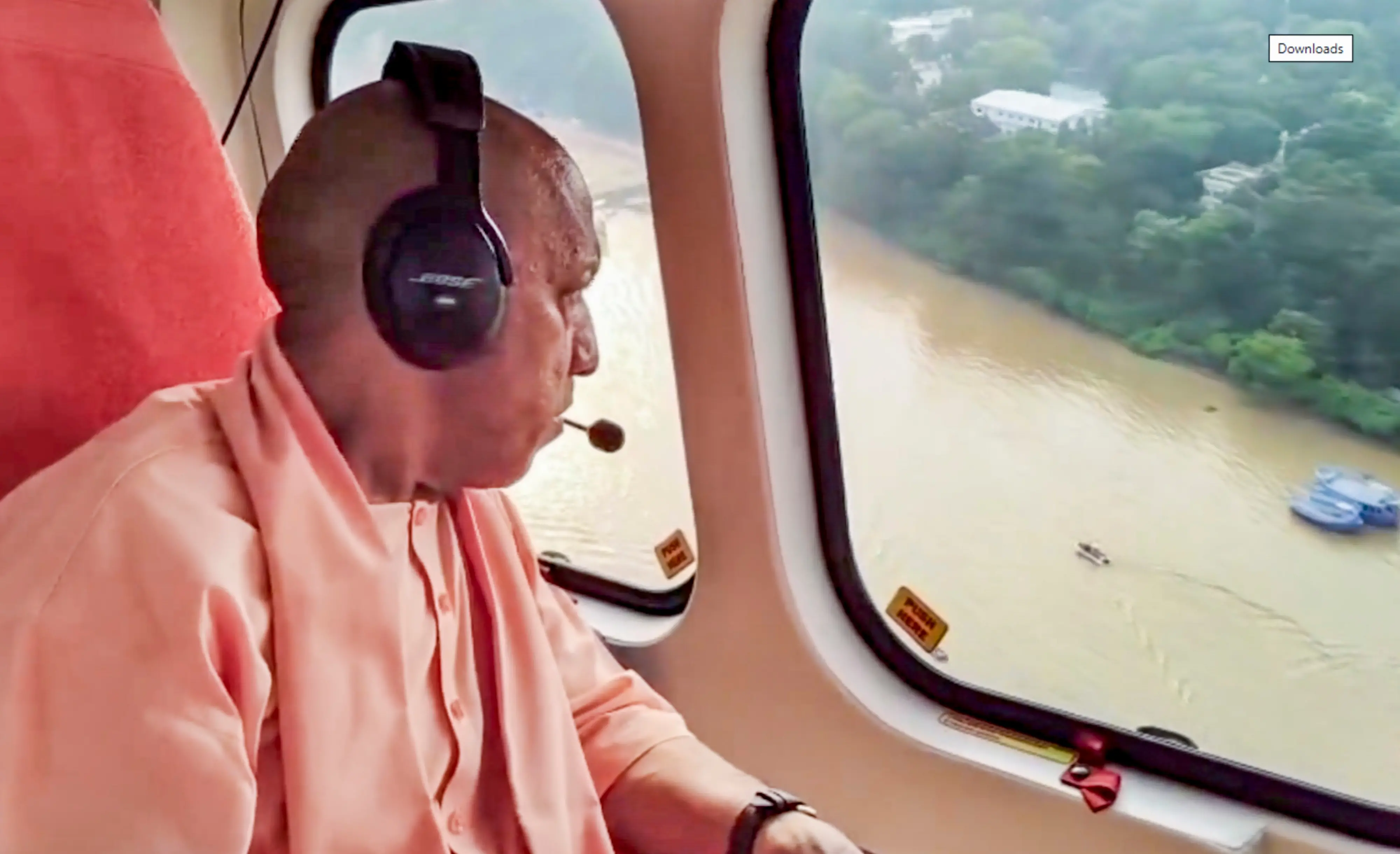 Uttar Pradesh Chief Minister Yogi Adityanath conducts an aerial survey to assess the flood situation along the Varuna river, in Varanasi.| Photo: PTI
