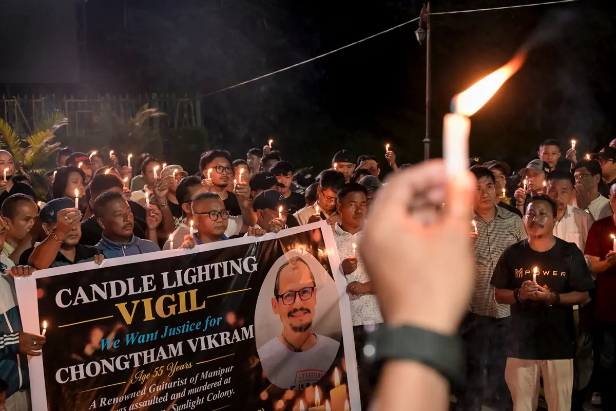 People participate in a candlelight vigil at the Western Gate of Kangla condemning the killing of Manipuri musician Chongtham Vikram Singh in New Delhi, in Imphal, Manipur | Photo: PTI