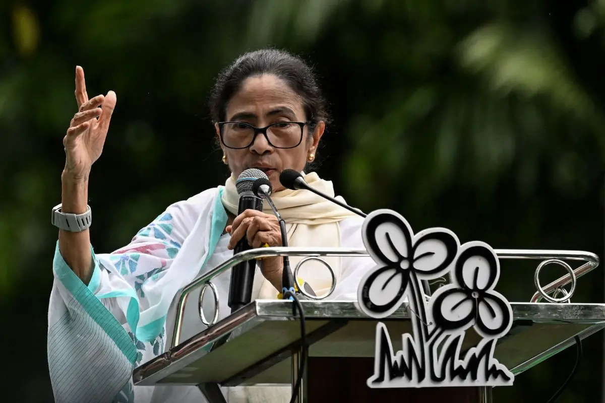 West Bengal's former chief minister and All India Trinamool Congress (TMC) party chairperson Mamata Banerjee addresses supporters during a public rally marking Martyrs' Day in Kolkata on July 21, 2026. (Photo by Dibyangshu SARKAR / AFP)