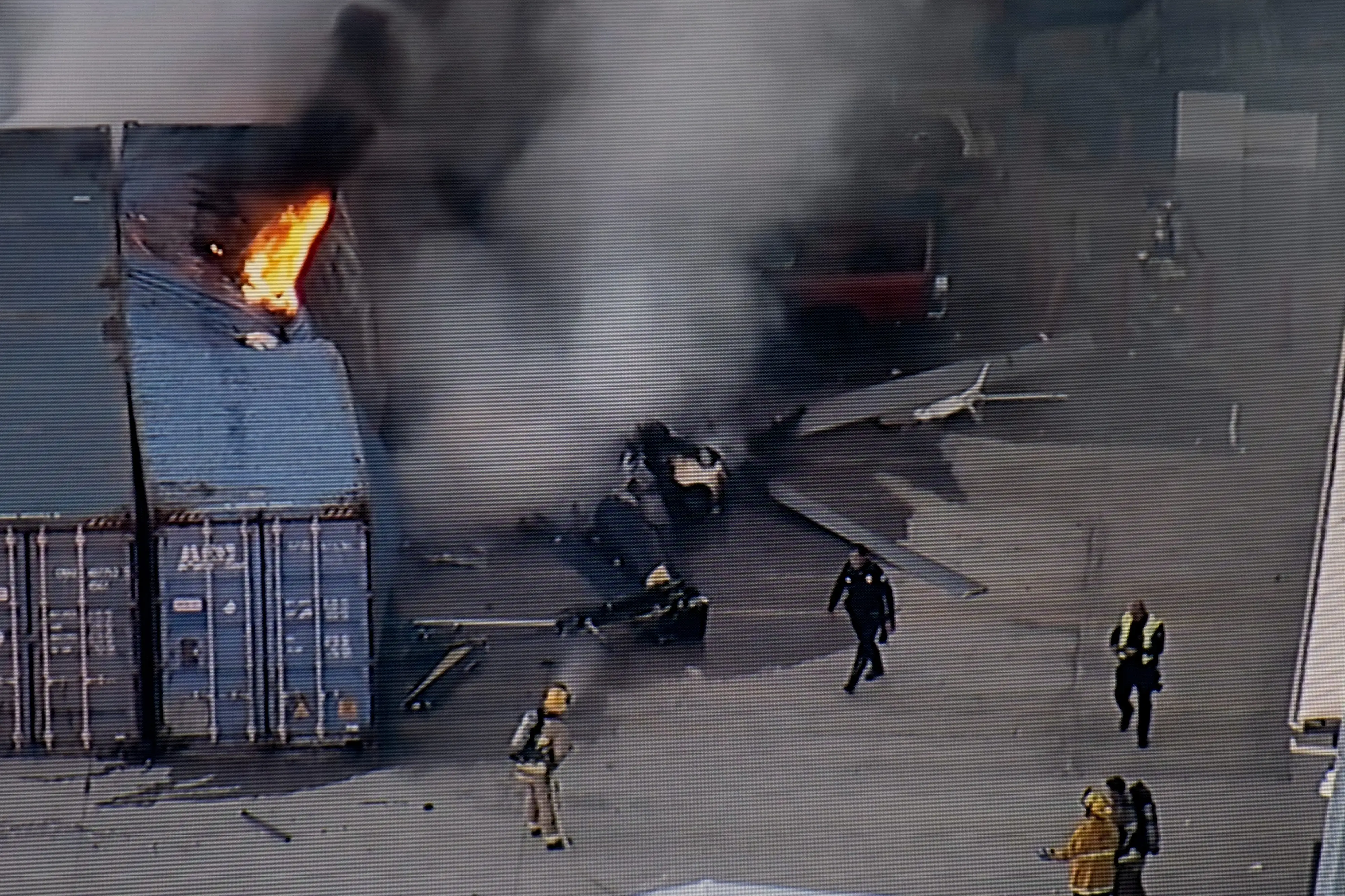 In this still image provided by KABC-TV shows first responders work the scene after a helicopter crashed near a bus crash in Chatsworth, a neighborhood in Los Angeles