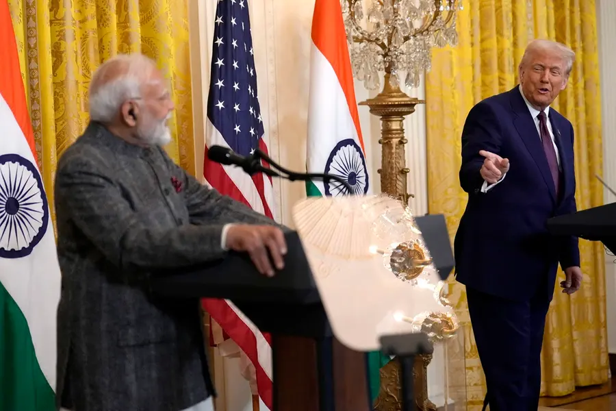 President Donald Trump, right, speaks as India's Prime Minister Narendra Modi listens during a news conference in the East Room of the White House