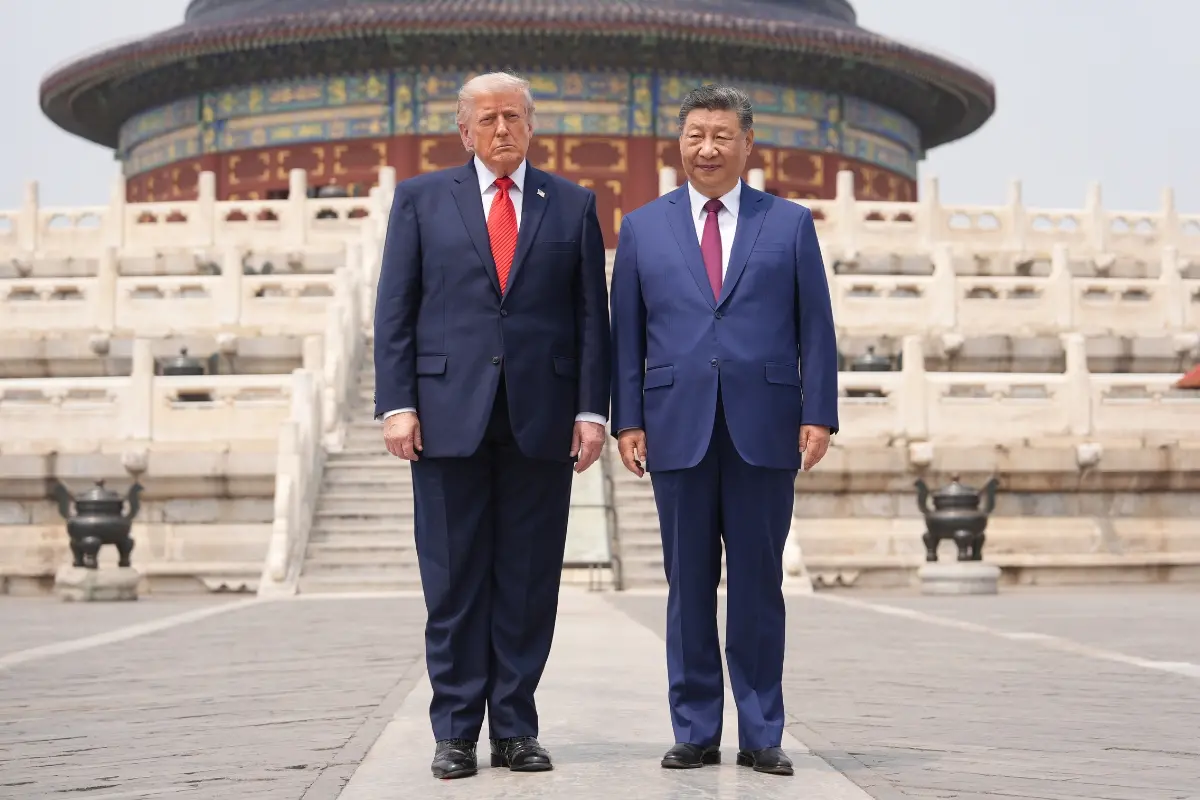 US President Donald Trump, left, stands with Chinese President Xi Jinping at the Temple of Heaven in Beijing.| Photo: AP