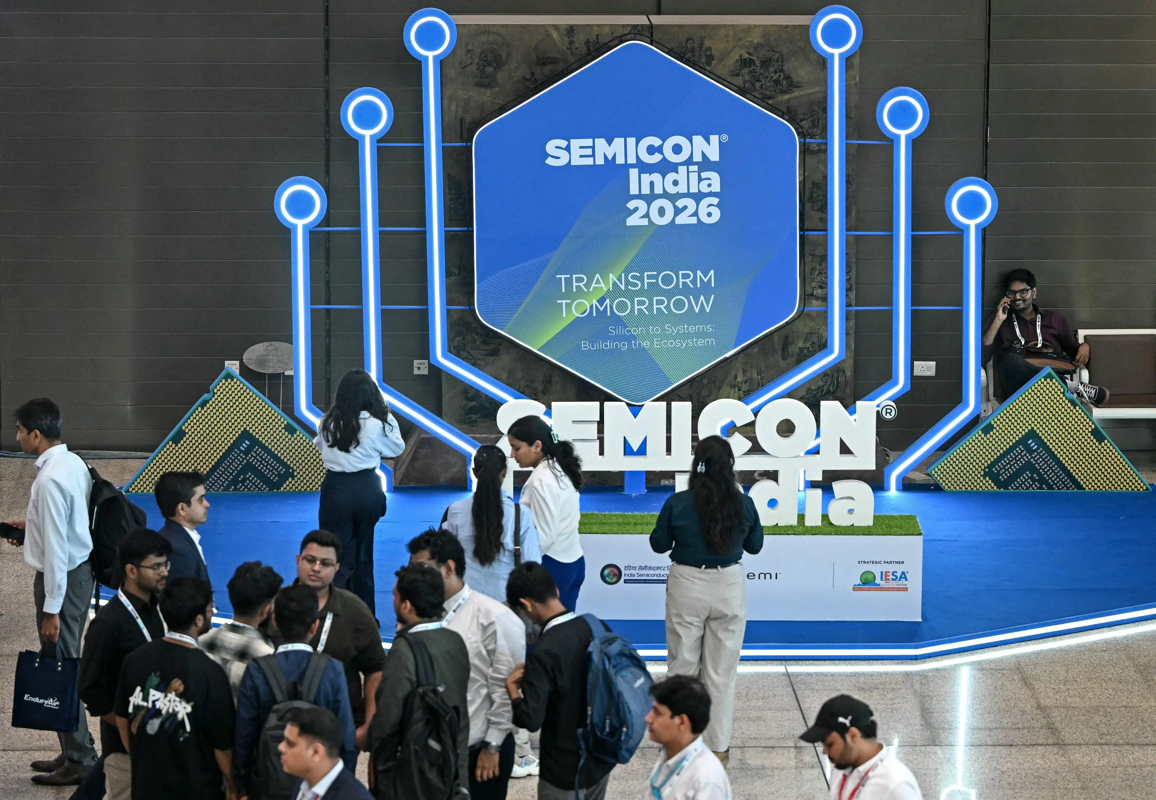 Visitors gather during the SEMICON India 2026 Conference & Expo on the semiconductor and electronics ecosystem at Yashobhoomi Convention Centre in New Delhi | Photo by Sajjad HUSSAIN / AFP