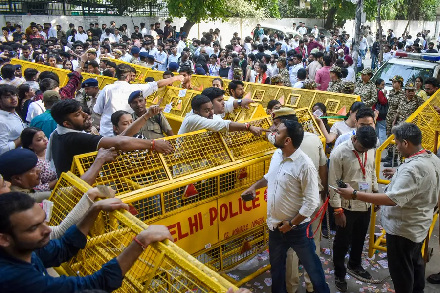 ABVP activists raise slogans during a protest, amid voting in the Delhi University Students Union (DUSU) elections, at Law Centre-I, Faculty of Law, in New Delhi