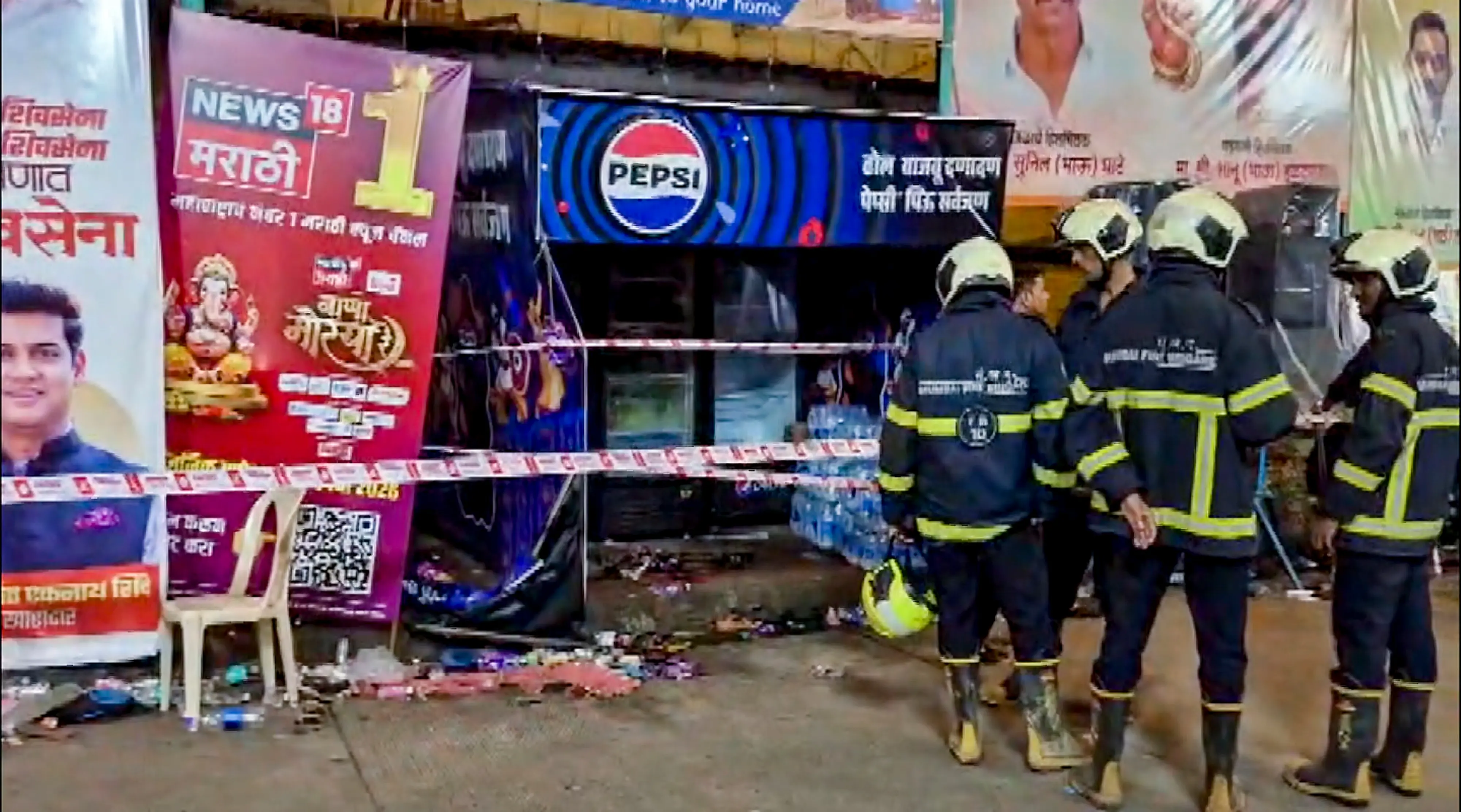 Rescue personnel stand near a sealed area after the electrocution incident near a Ganapati pandal, at Lalbaug area, in Mumbai | Photo: PTI