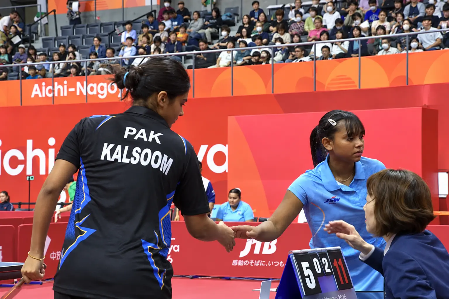 India and Pakistan paddlers shaking hands after their Asian Games 2026 women's table tennis clash in Aichi-Nagoya.