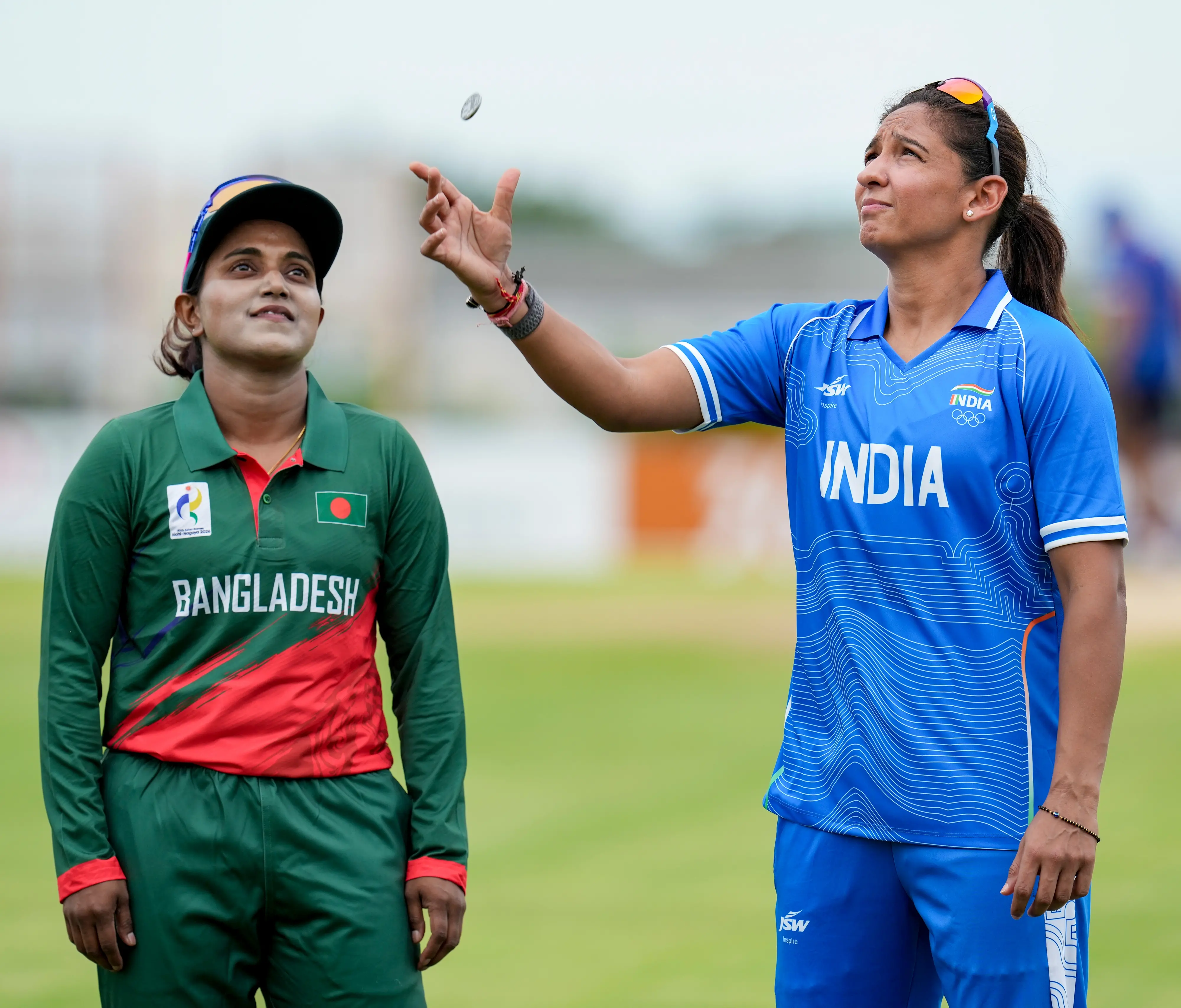 India's captain Harmanpreet Kaur, right, and Bangladesh's Nigar Sultana | Photo: PTI