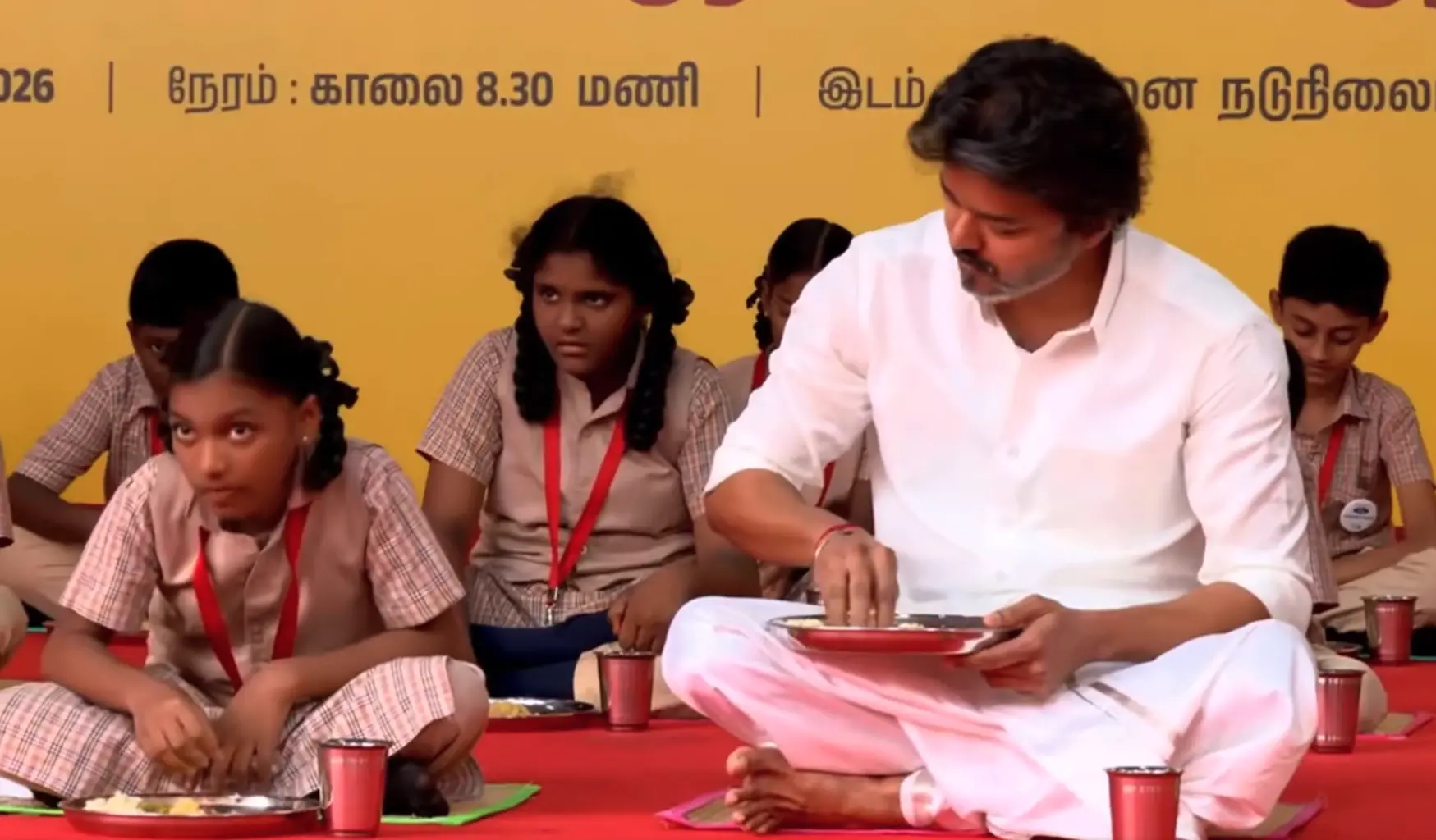 Chief Minister C. Joseph Vijay eats breakfast with students of the school after launching the expansion of the rechristened Perunthalaivar Kamarajar Free Breakfast Scheme at Government Middle School in Gandhi Gramam, Thiruvanmiyur | Photo: X