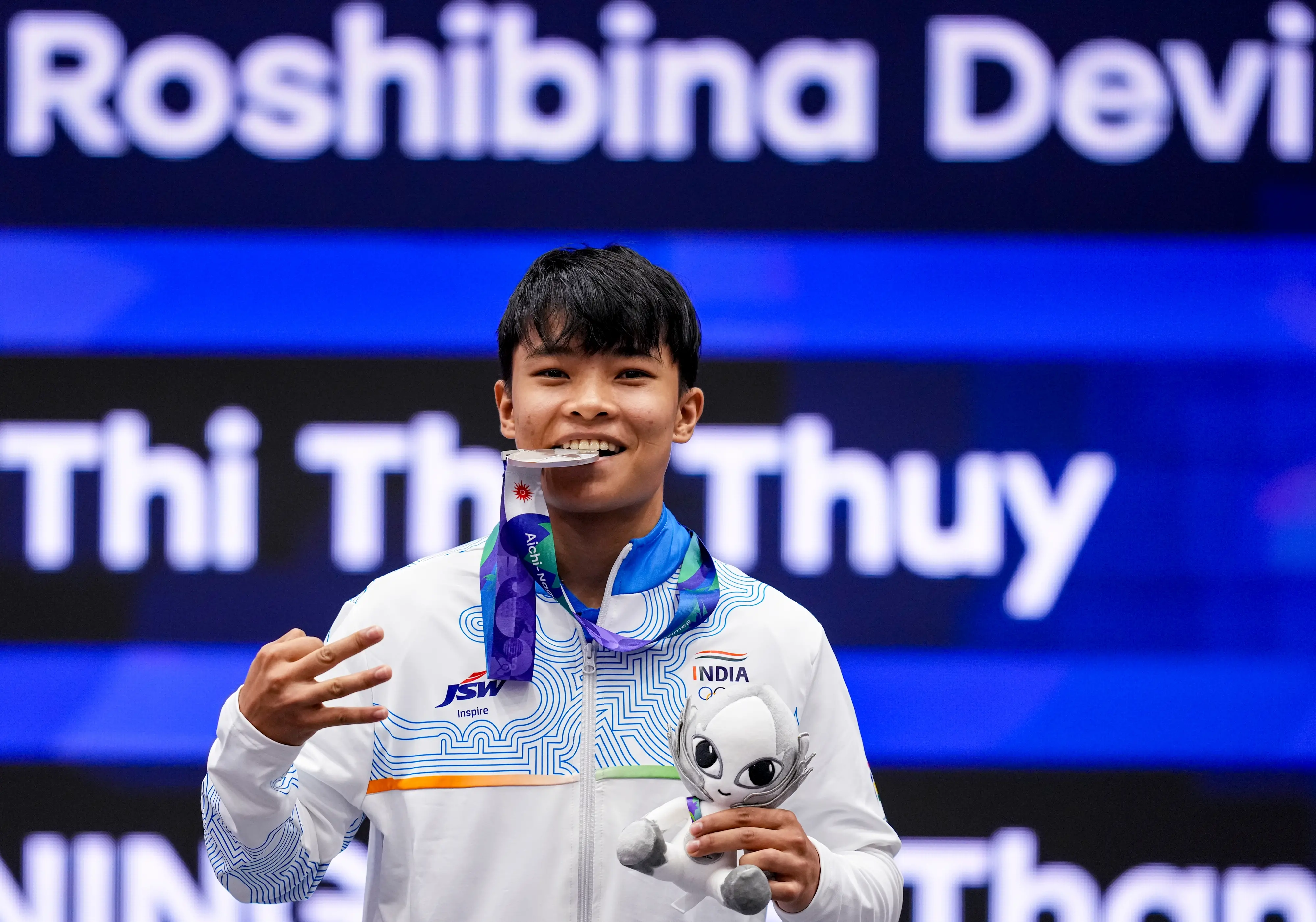 India's Roshibina Devi Naorem holds the silver medal after the Women's 60kg Wushu final match during the 20th Asian Games, in Nagoya, Japan.| Photo: PTI