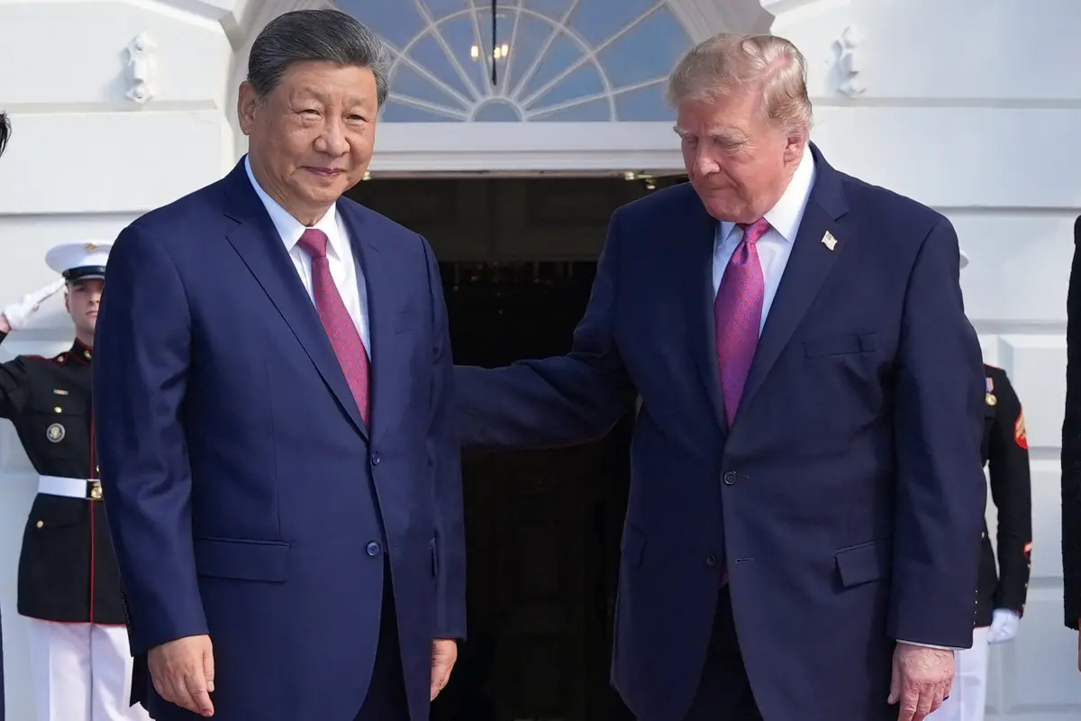 US President Donald Trump, right, greets China's President Xi Jinping | Photo: AP/PTI