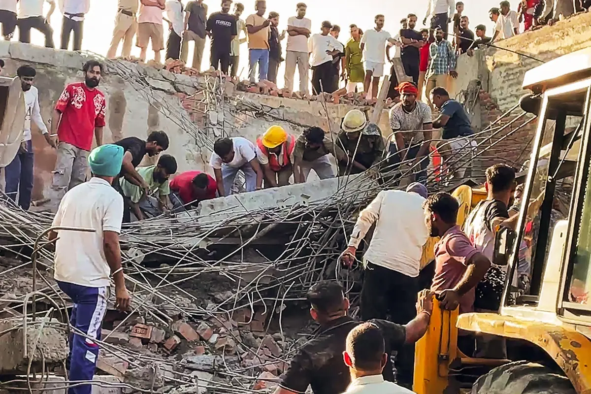 Rescue operation underway after a three-story under-construction building collapsed at Dhulkot village, in Ambala on Sunday. (ANI Video Grab)