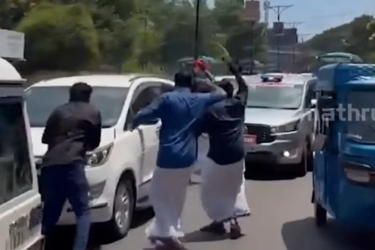 Yuva Morcha activists waving black flags at V D Satheesan's convoy