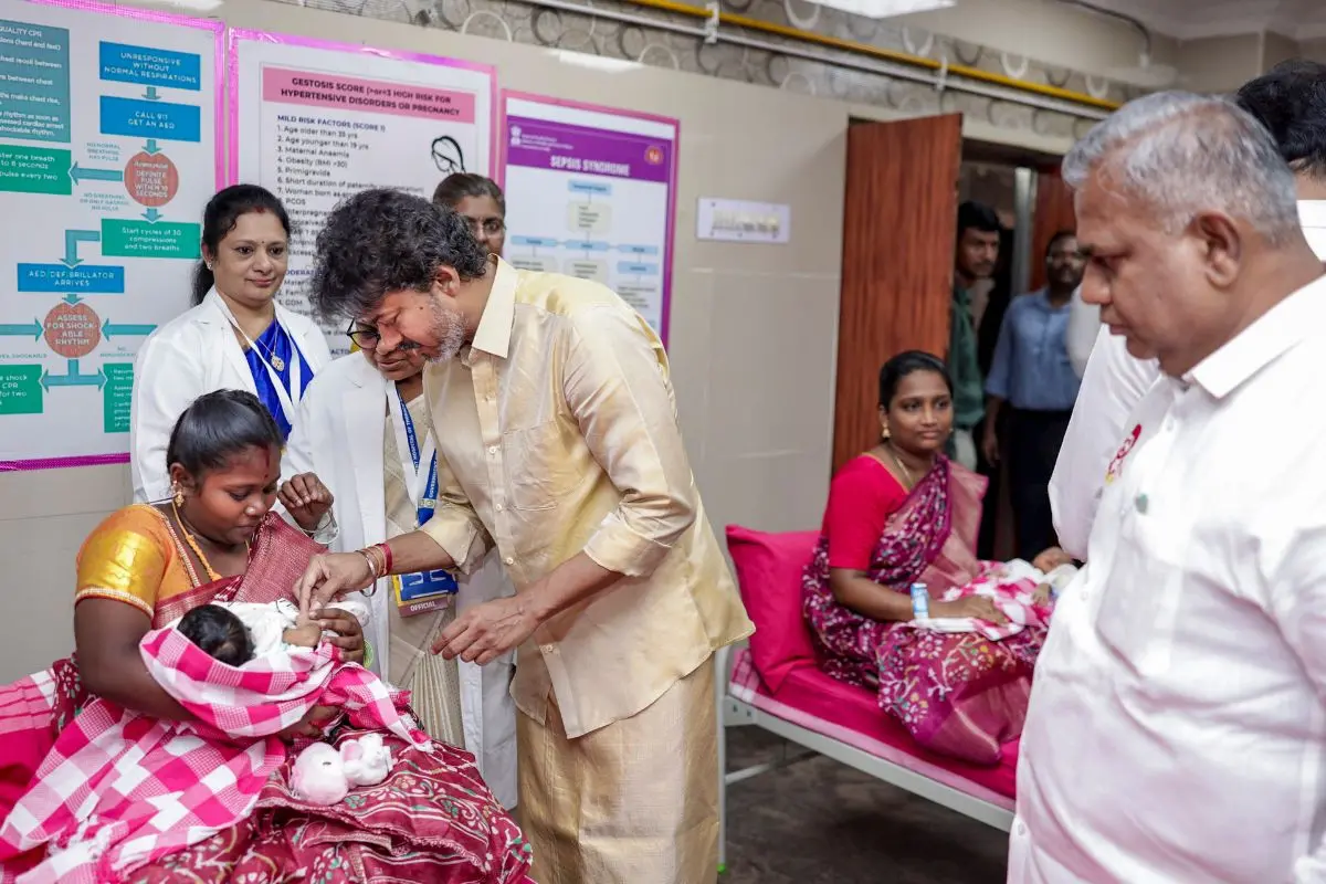 Tamil Nadu Chief Minister C Joseph Vijay presents a gold ring to a newborn baby during the launch of the state government's 'Thai Maman Thanga Mothiram' (Maternal Uncle's Gold Ring) scheme, in Madurai. (@CMOTamilnadu/X via PTI Photo)