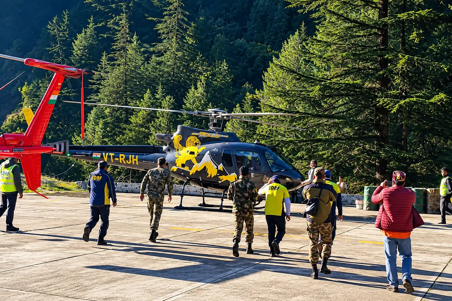 A helicopter lands at a helipad as SDRF personnel and other rescue teams coordinate operations in Uttarkashi amid the ongoing evacuation of stranded trekkers. (ANI Screengrab)