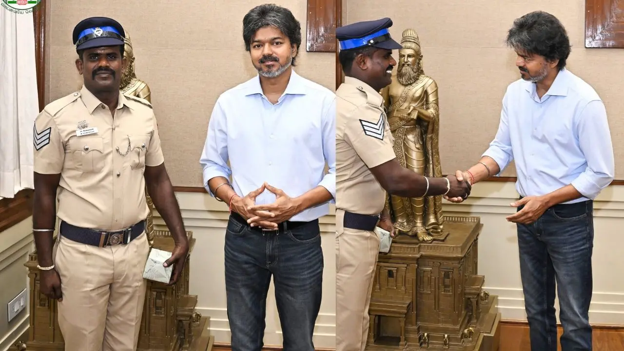 ഹെഡ് കോൺസ്റ്റബിൾ എം. വേൽമുരുകനെ മുഖ്യമന്ത്രി സി. ജോസഫ് വിജയ് അഭിനന്ദിക്കുന്നു