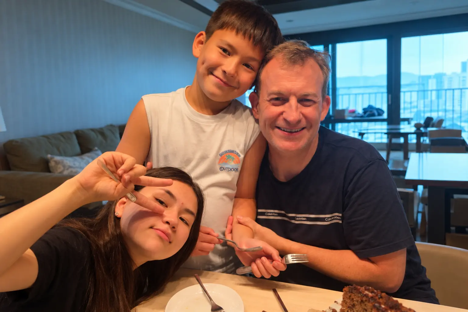 Nine years after their viral live-TV interruption, Robert Kelly poses with his now-grown children, Marion and James.