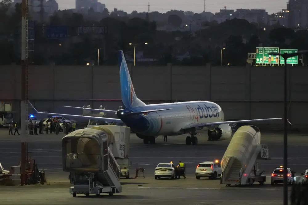 A flyDubai aircraft carrying Israelis who experienced an emergency landing in Saudi Arabia is seen parked at Ben Gurion International Airport, near Tel Aviv, Israel | AP