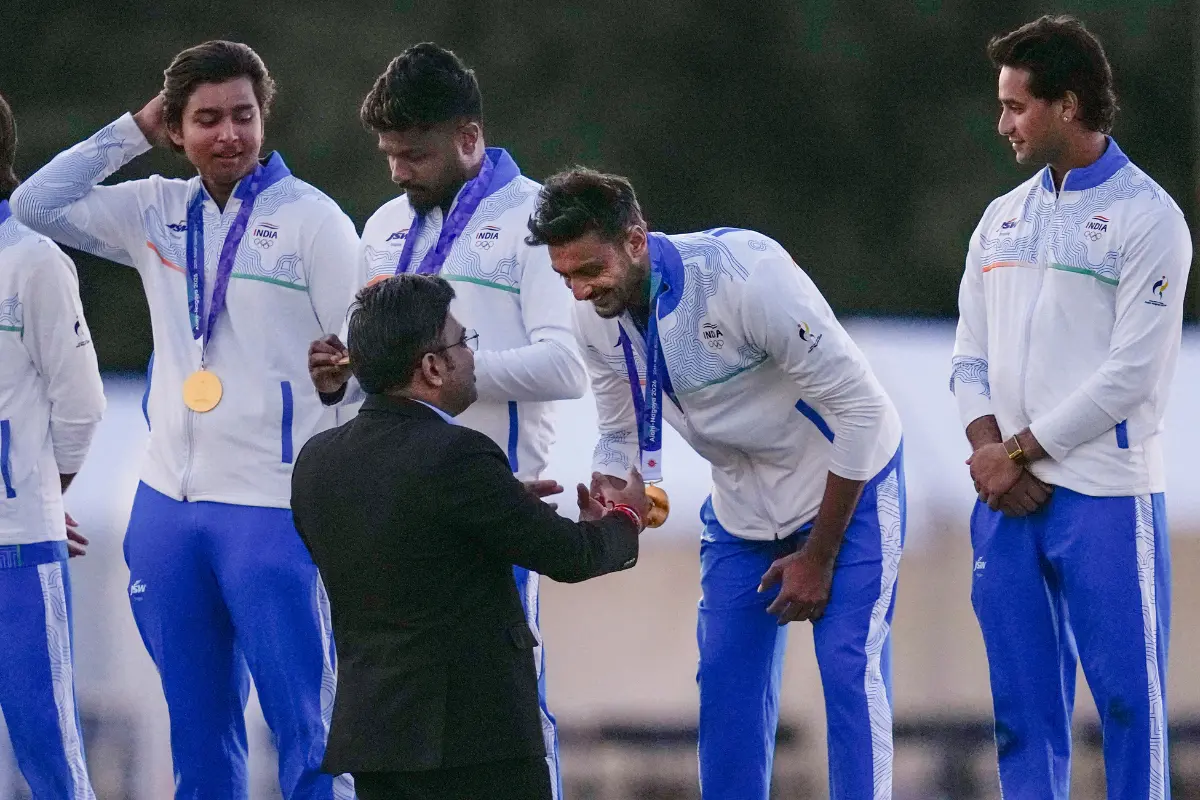 International Cricket Council (ICC) Chairman Jay Shah exchanges a handshake with India's Axar Patel during the medal ceremony | Photo: PTI