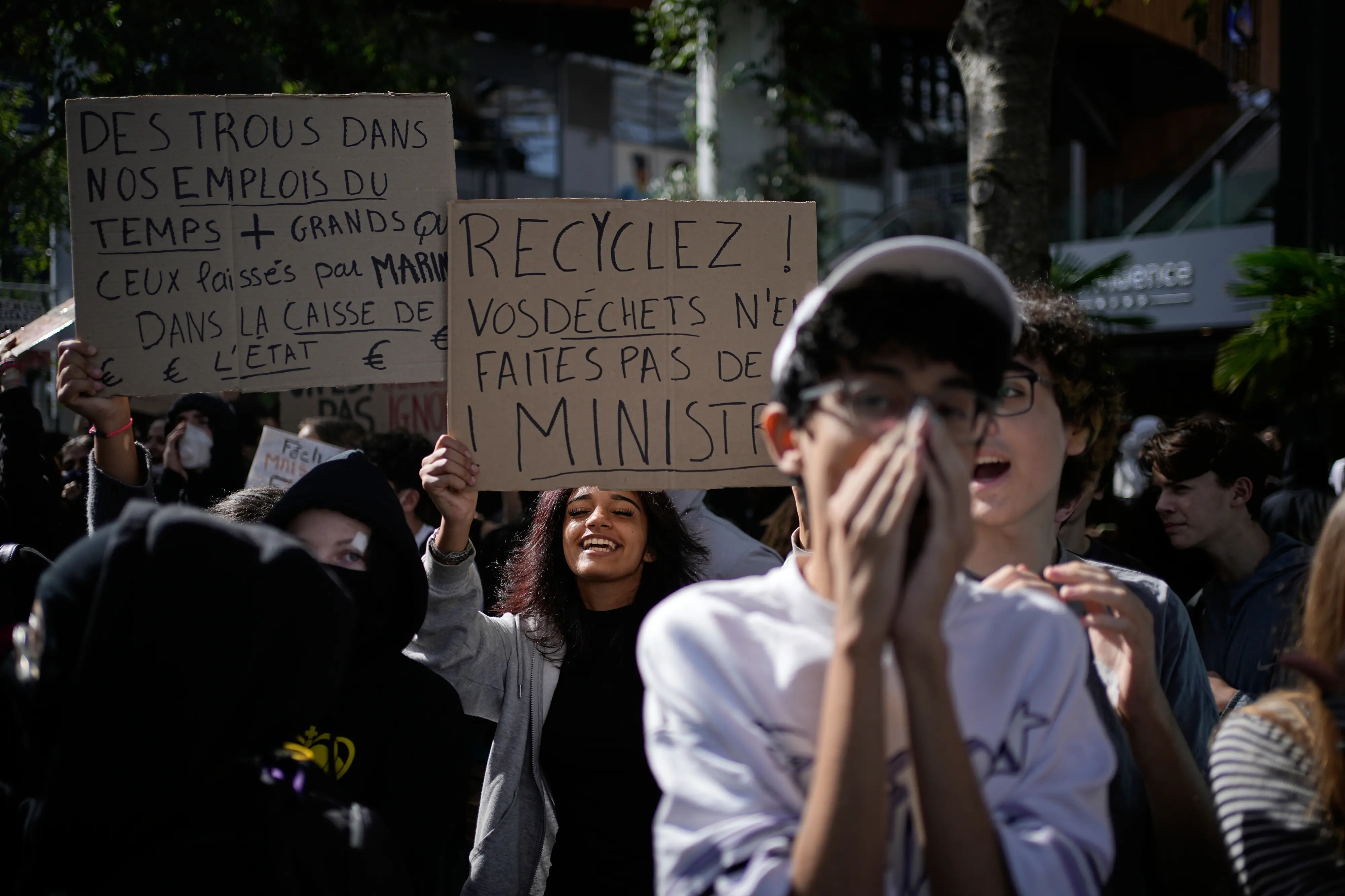 A student hold a board reading "Recycle your waste, don't make them ministers" during a protest against under-resourced schools in Lyon, France.| Photo: AP/PTI