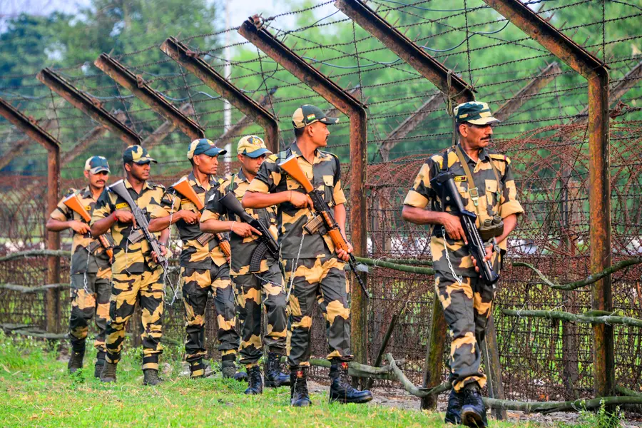 Border Security Force (BSF) personnel patrol along the India-Bangladesh border, at Phulbari, on the outskirts of Siliguri | Photo: PTI