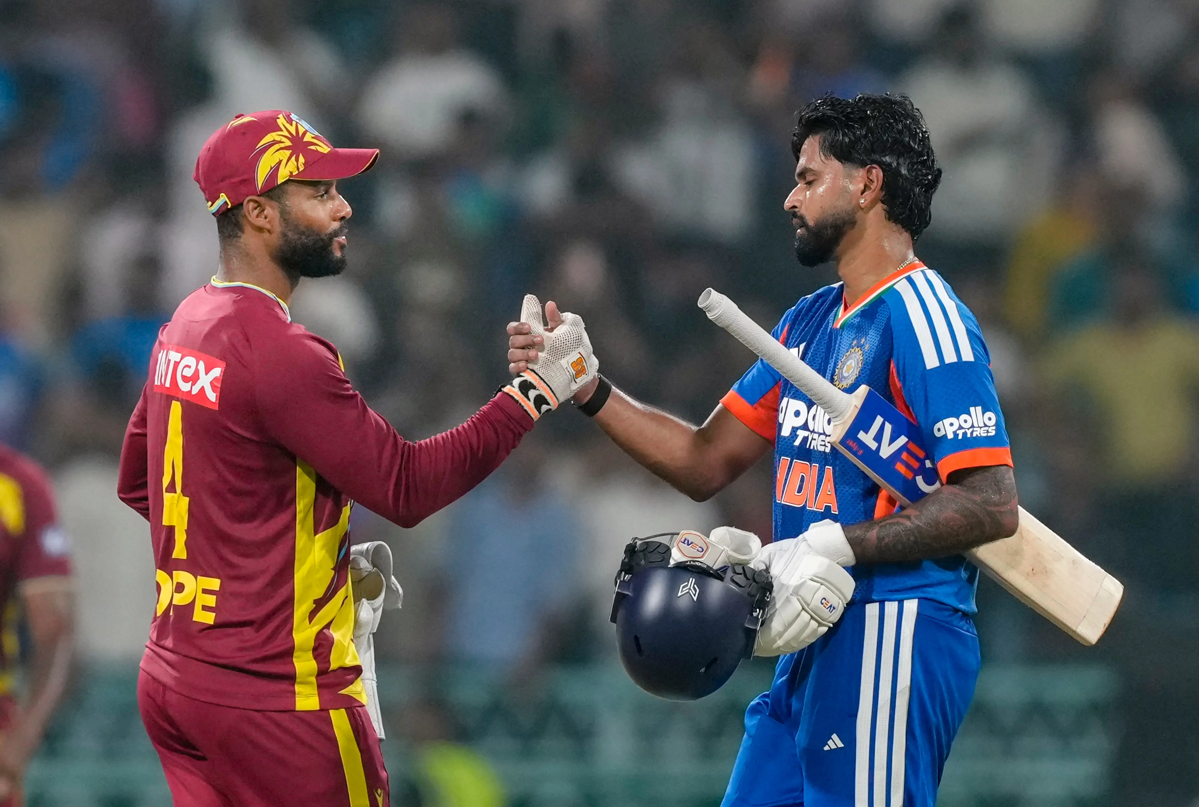 India's captain Shreyas Iyer, right, shakes hands with West Indies' captain Shai Hope after winning the first T20I cricket match of a series between India and West Indies, in Lucknow