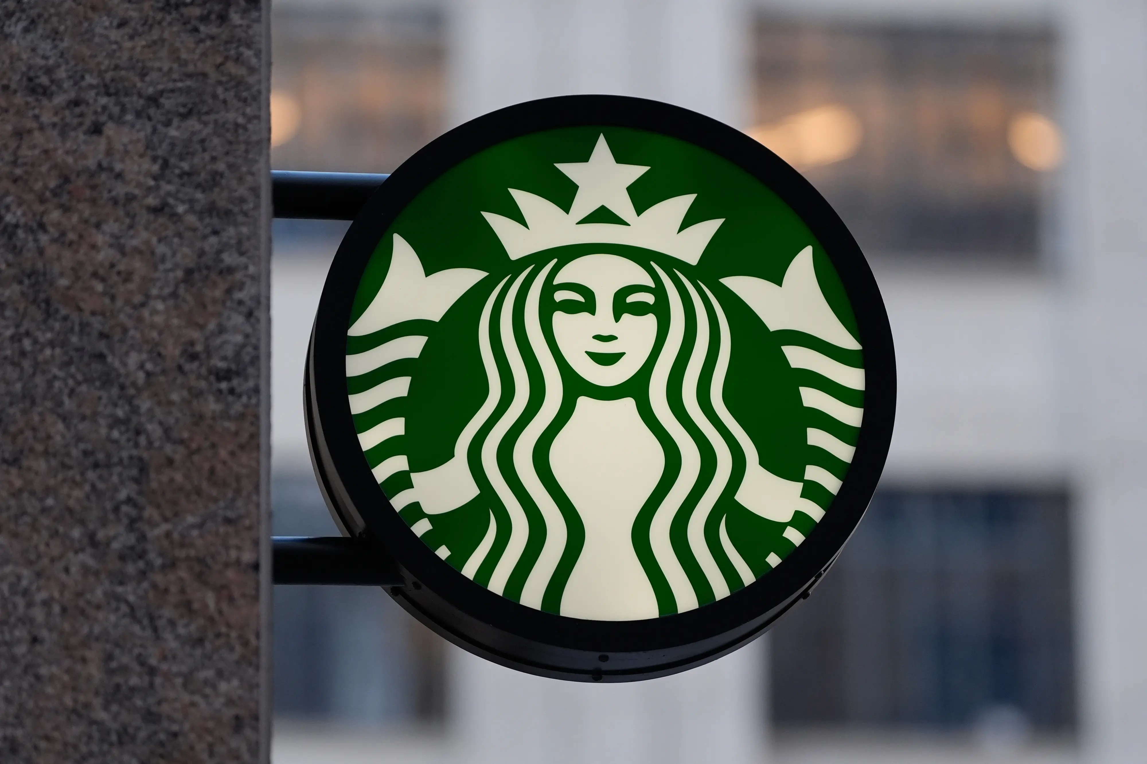 FILE - The Starbucks logo is displayed on a coffee shop, Nov. 24, 2025, in Boston. (AP Photo/Charles Krupa, File)