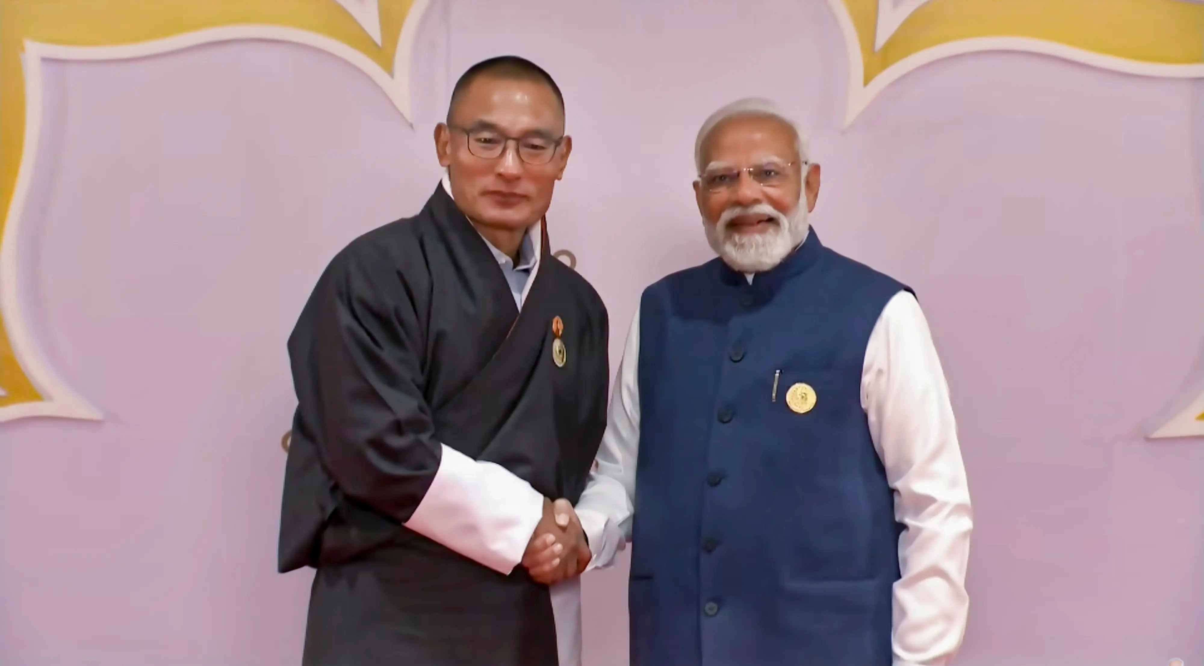Prime Minister Narendra Modi with with his Bhutanese counterpart Tshering Tobgay Guterres during the AI Impact Summit, in New Delhi.| Photo: PTI