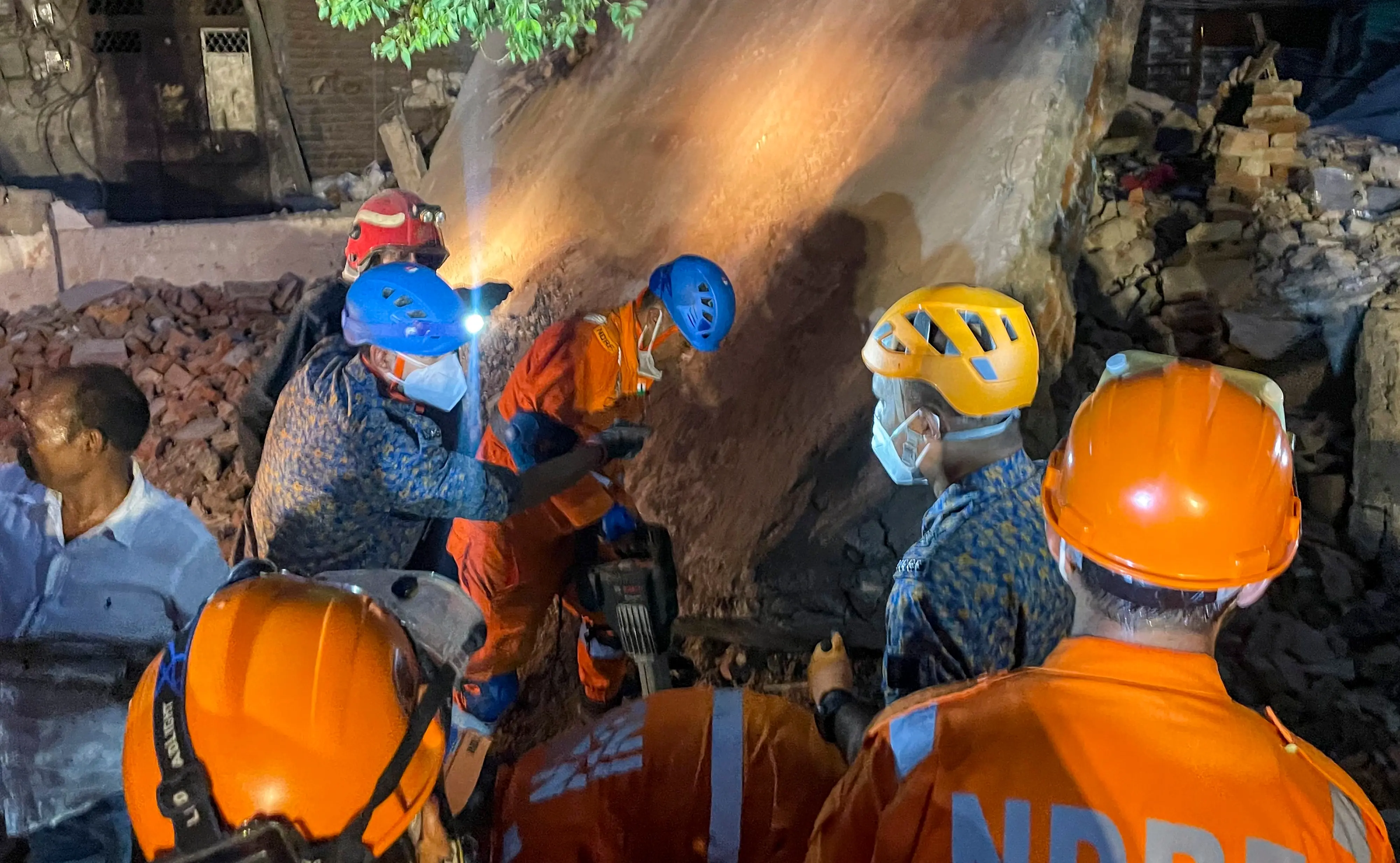 Rescue operation underway after a four-storey building collapsed, with debris burying portions of two to three adjoining houses, at Seemapuri area, in New Delhi, Wednesday, Oct. 7, 2026.| Photo: PTI