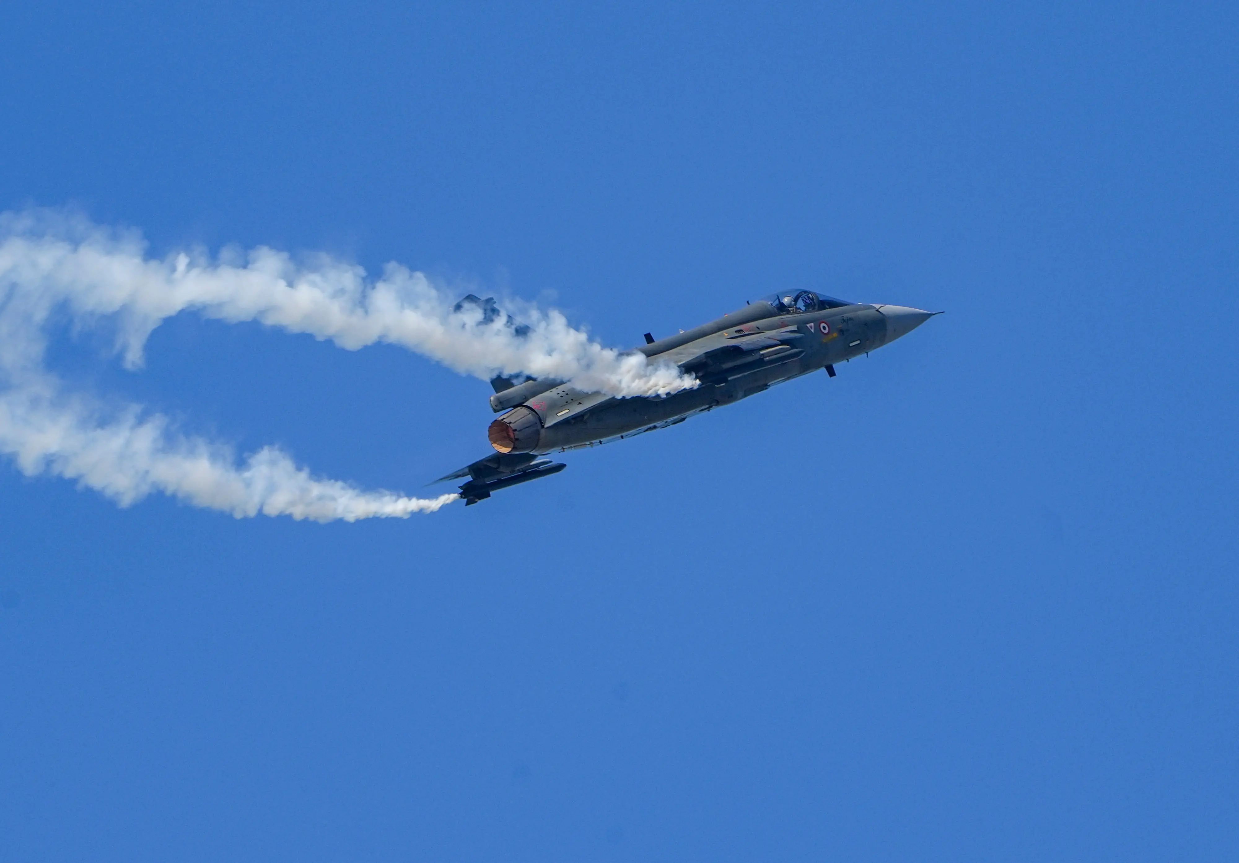 IAF's Tejas performs manoeuvres during an air show marking the 93rd anniversary celebrations in 2025, at Lachit Ghat over the Brahmaputra river, in Guwahati.| Photo: PTI