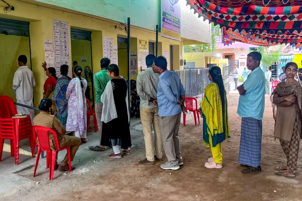 People wait in a queue at a polling station on the day of voting in the Madurantakam Assembly bypolls, in Chengalpattu district, Tamil Nadu, Tuesday, Oct. 6, 2026 (Photo: PTI)