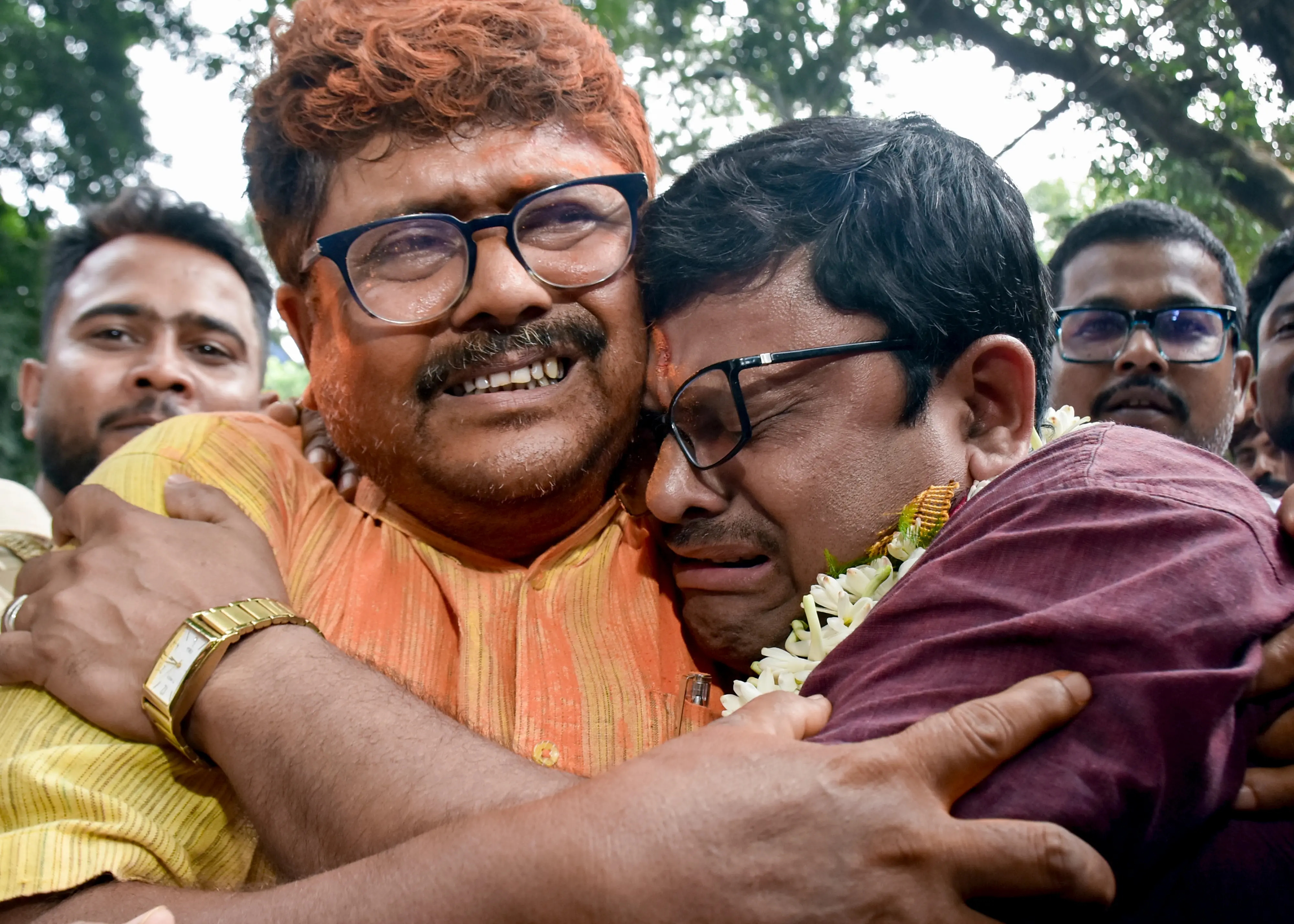 BJP candidate from Rejinagar Assembly Sakharav Sarker, right, reacts after the party leads | PTI