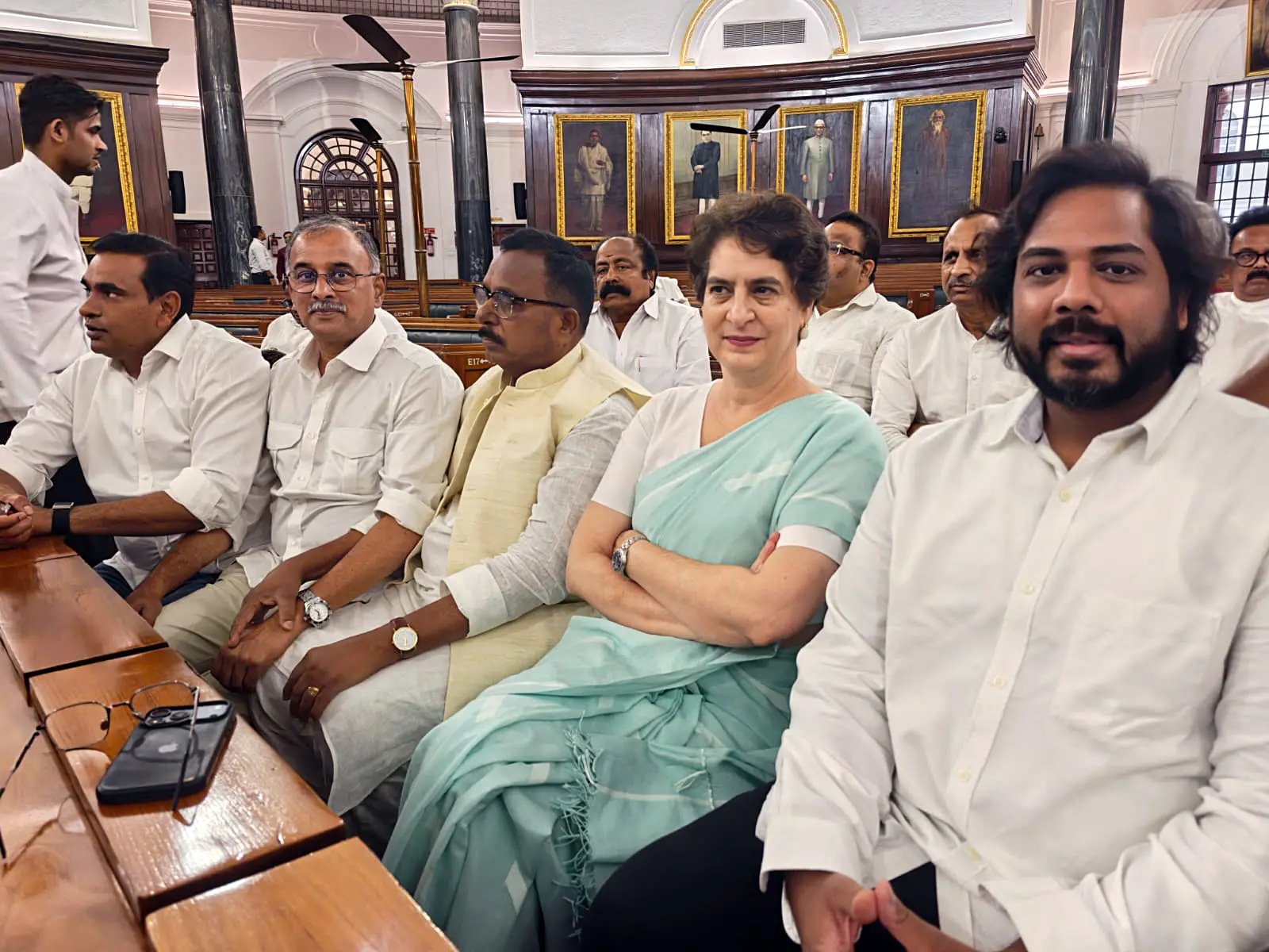 Congress MP Priyanka Gandhi Vadra and INDIA bloc MPs at the Parliament's Central Hall ahead of their meeting with President Droupadi Murmu over the Election Commission of India's functioning, in New Delhi.| Photo: PTI