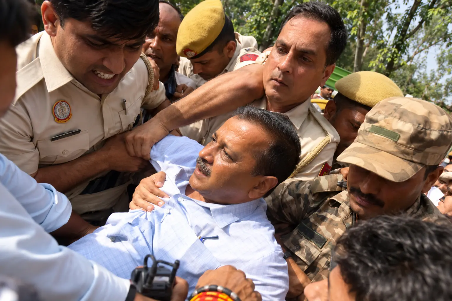 Arvind Kejriwal is seen being detained by Delhi Police personnel amid heightened tensions in the national capital during the CJP protest at Jantar Mantar on Saturday.