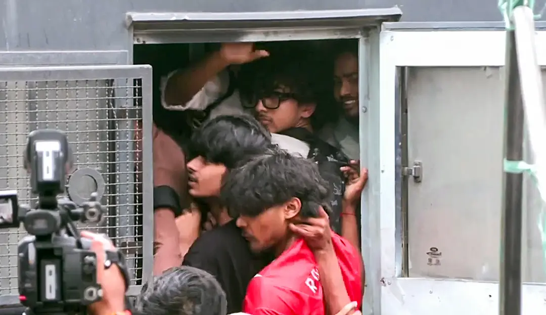Delhi Police detain protesters near Connaught Place amid the CJP protest, in New Delhi on Saturday. (ANI Video Grab)