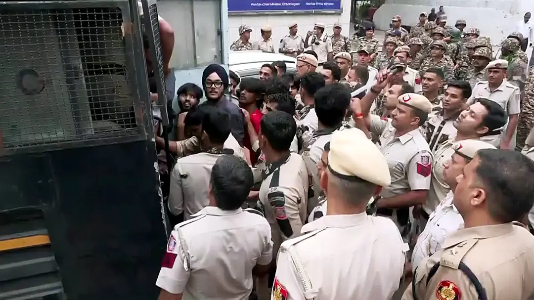 Delhi Police detain protesters near Connaught Place amid the CJP protest in New Delhi on Saturday. (ANI Video Grab)