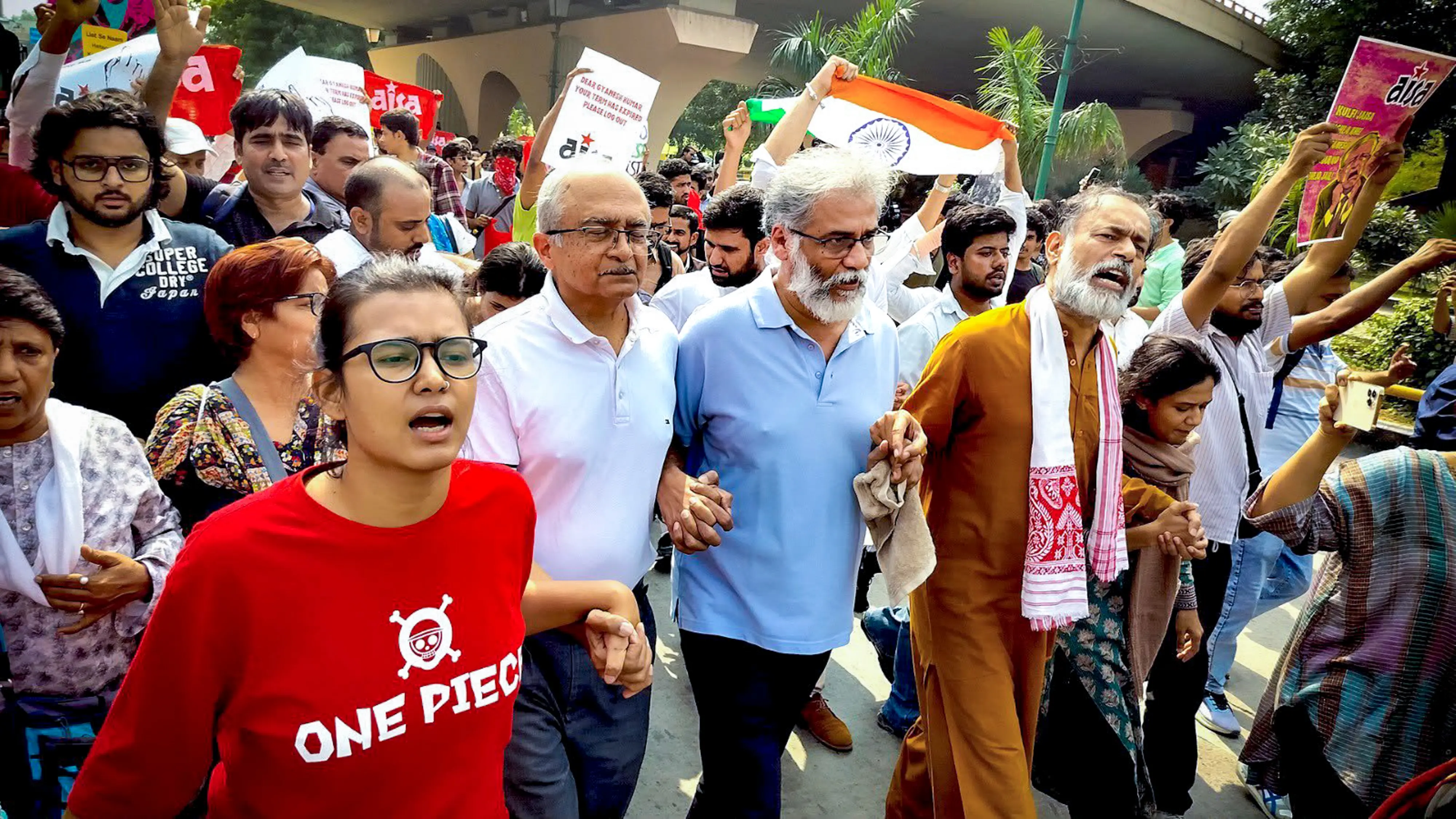 All India Students' Association (AISA) National President Neha Bora, advocate Prashant Bhushan, activist Yogendra Yadav, and CPI(ML) Liberation General Secretary Dipankar Bhattacharya lead a march near INA Market towards Jantar Mantar