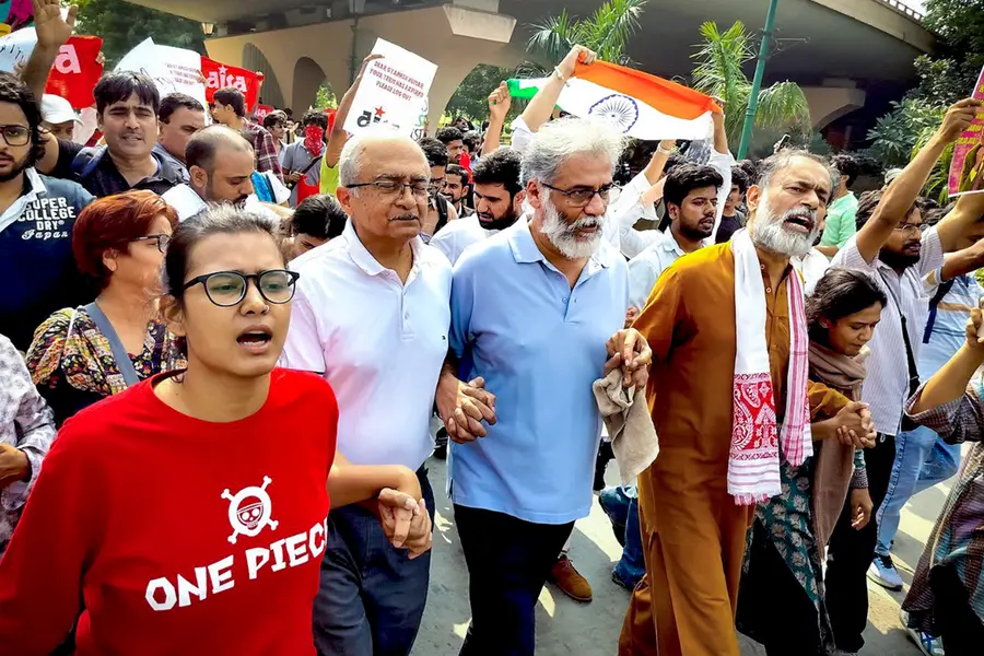 All India Students' Association (AISA) National President Neha Bora, advocate Prashant Bhushan, activist Yogendra Yadav, and CPI(ML) Liberation General Secretary Dipankar Bhattacharya lead a march near INA Market towards Jantar Mantar
