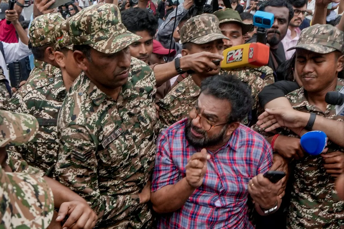 Police personnel detain CPM MP John Brittas amid continued demonstration calls by the Cockroach Janta Party (CJP) demanding the resignation of Chief Election Commissioner (CEC) | Photo: PTI