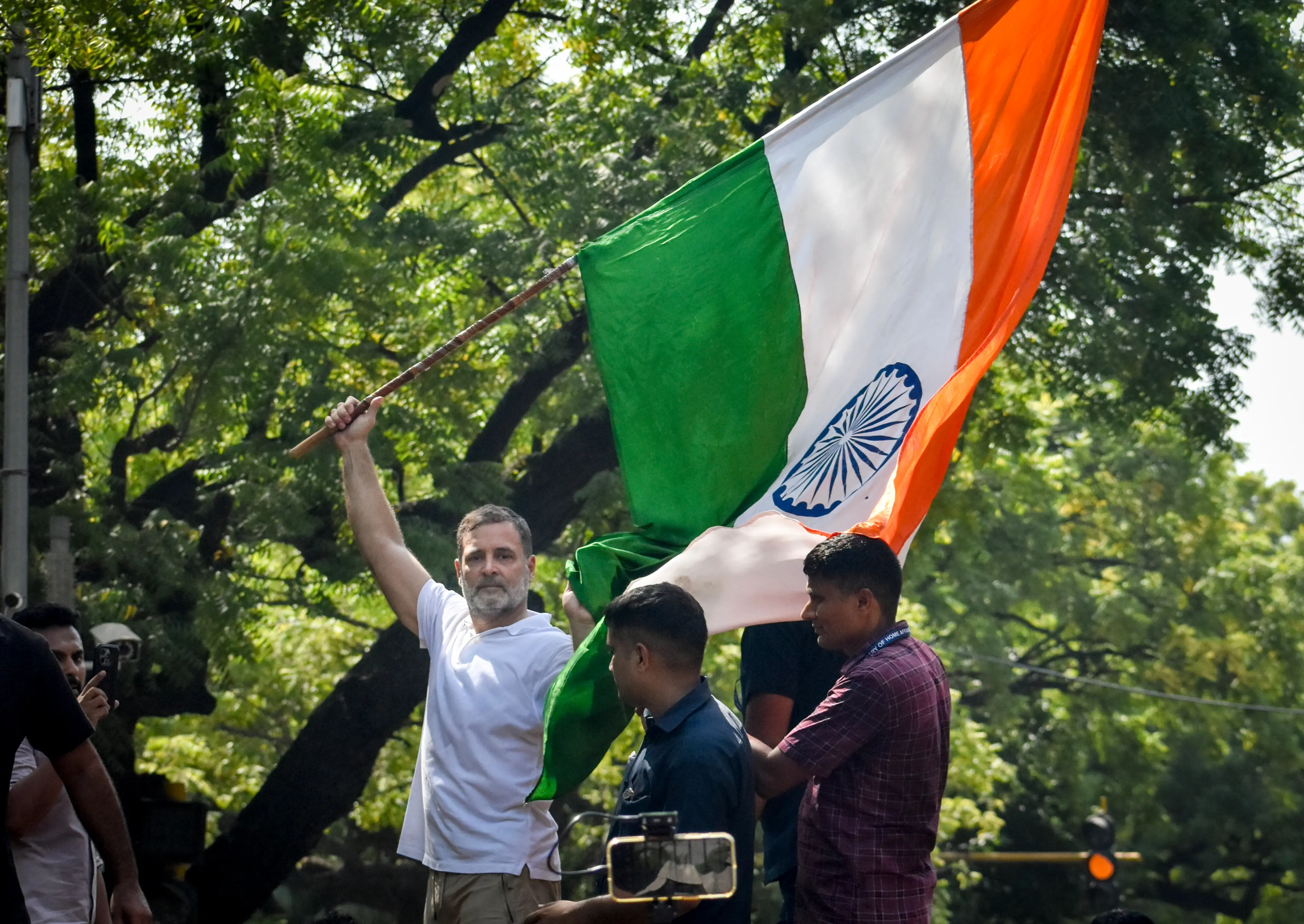 Rahul Gandhi demonstrates with national flag in Delhi protest | Photo: PTI