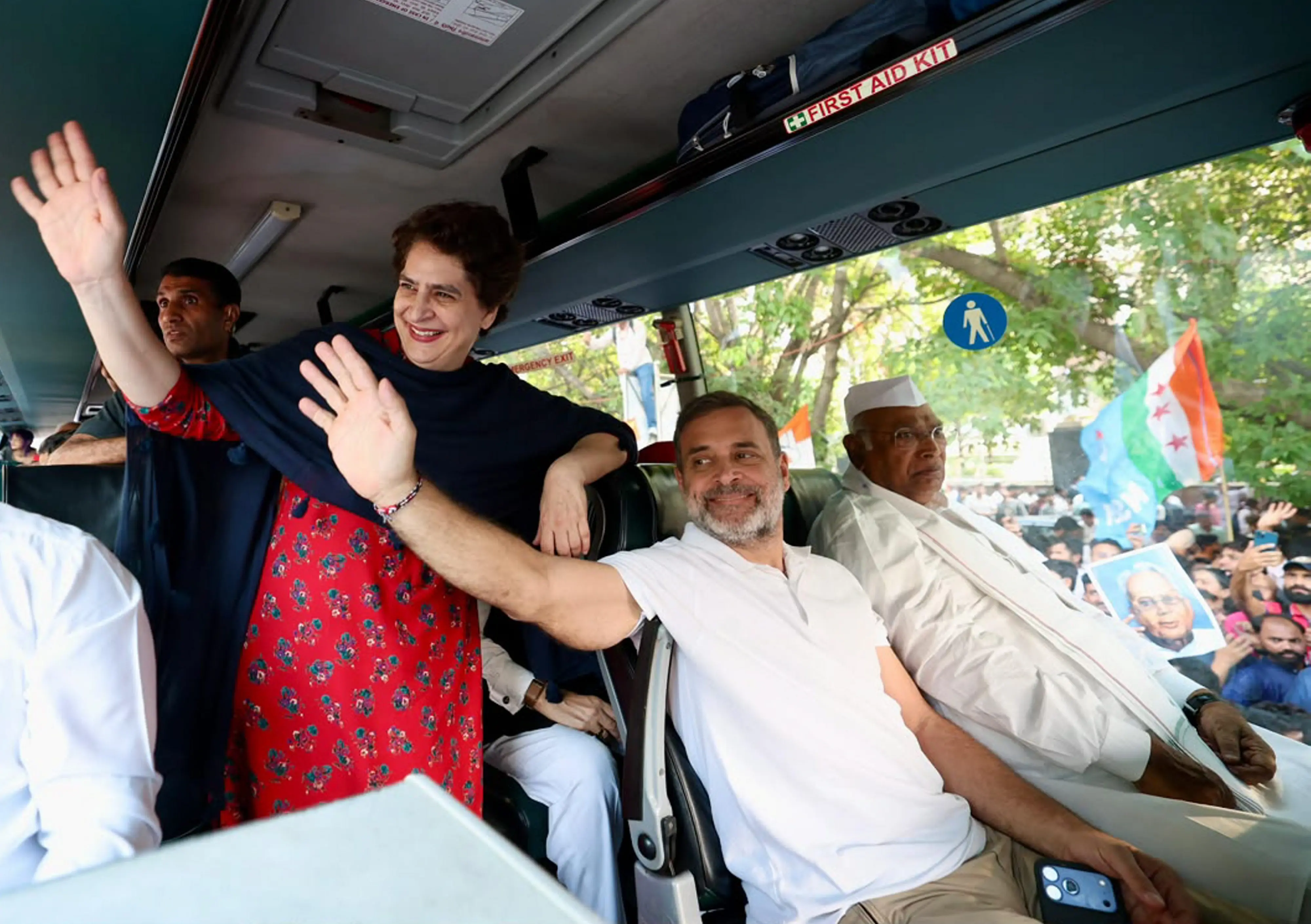 Congress President Mallikarjun Kharge, party leader Rahul Gandhi and other members of the INDIA bloc move in a bus towards the Supreme Court to file a petition against Special Intensive Revision (SIR) of electoral rolls and alleged poll irregularities, in New Delhi.| Photo: PTI
