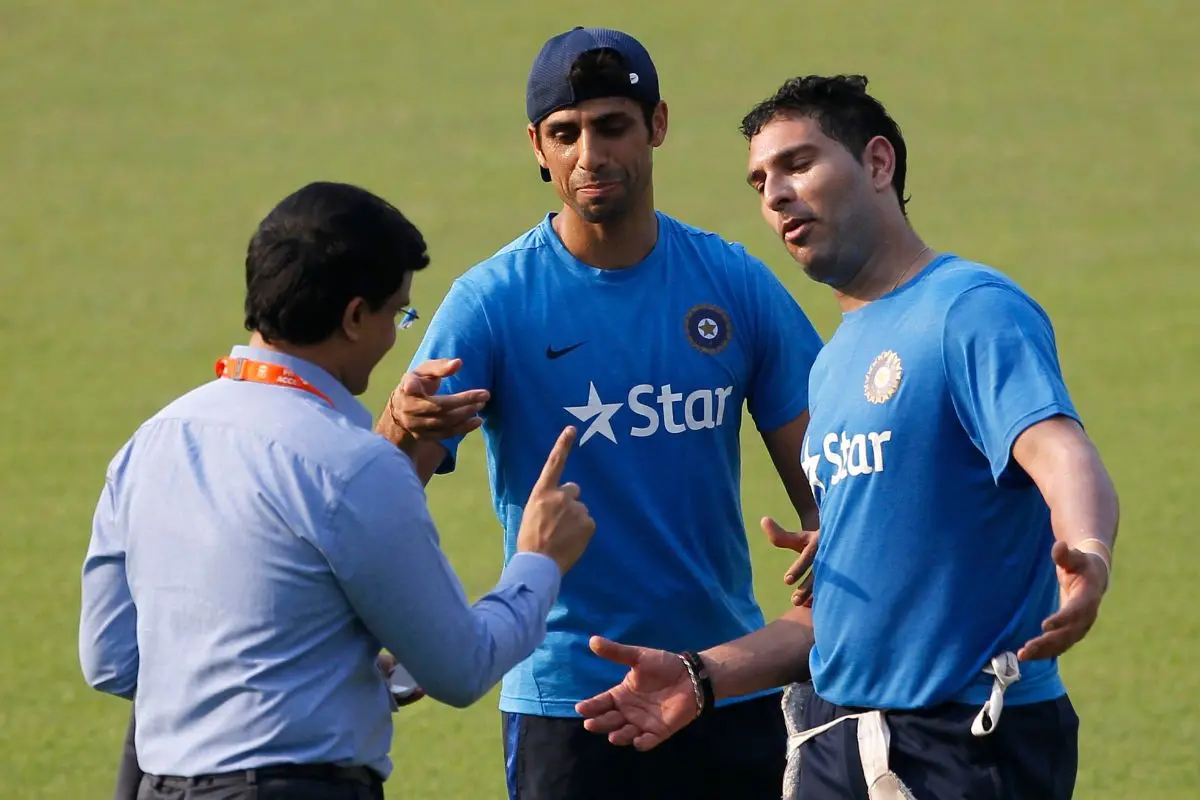 Indian cricketers Yuvraj Singh, right, and Ashish Nehra, center, meet former Indian cricket team captain Sourav Ganguly during a practice session. | File Photo: AP