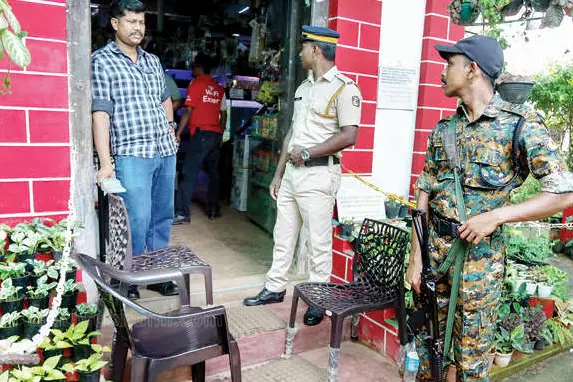 Police personnel stationed outside the Jewish synagogue at Ernakulam Market Kadavu after banners placed in front of the synagogue were set on fire early Monday morning