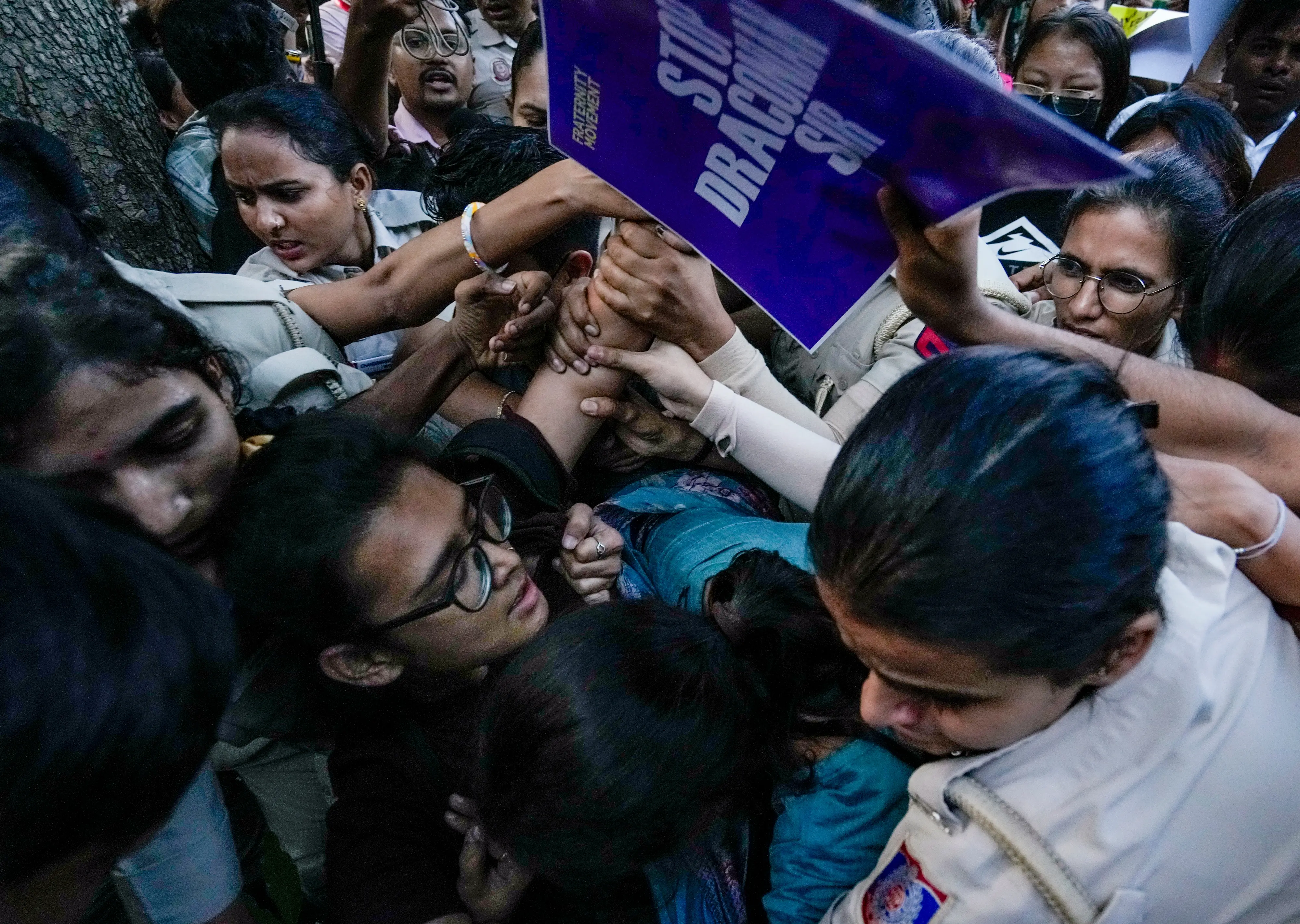 AISA chief Neha Bora being detained by the Delhi Police at Mandi House in New Delhi on Friday, Oct 16, 2026 | Photo: PTI