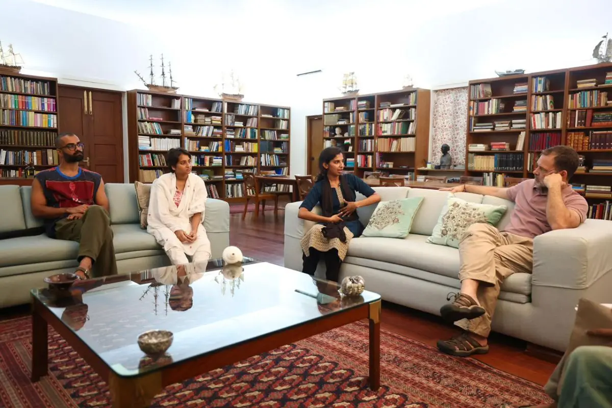 In this image posted on Oct. 16, 2026, Leader of the Opposition in Lok Sabha Rahul Gandhi interacts with student activists who were allegedly beaten up by Delhi Police during a protest, in New Delhi. (@INCIndia/X via PTI Photo)