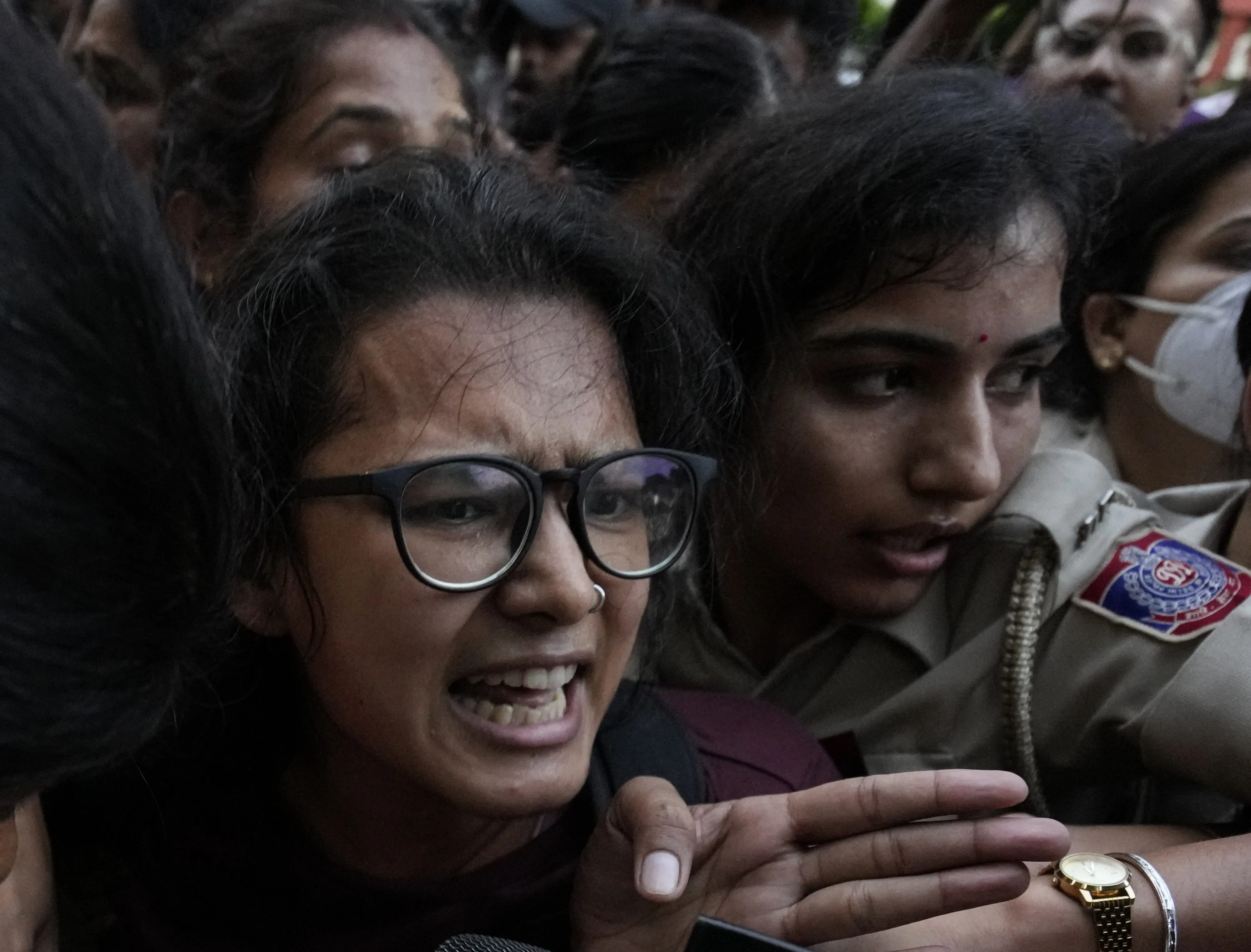 AISA chief Neha Bora being detained by the police during a protest against Chief Election Commissioner (CEC) Gyanesh Kumar, demanding his resignation over alleged irregularities in the Special Intensive Revision (SIR) of electoral rolls, at Mandi House