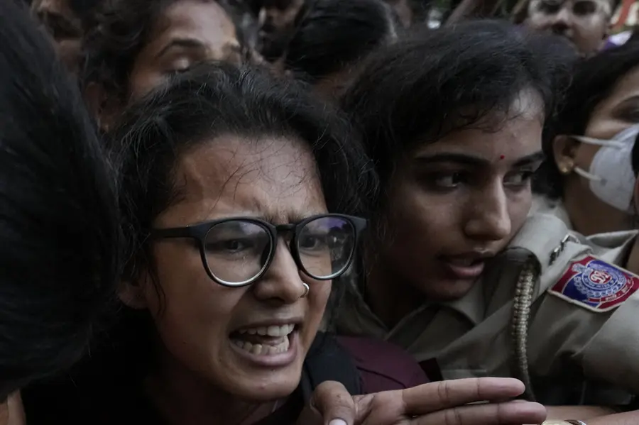 AISA chief Neha Bora being detained by the police during a protest against Chief Election Commissioner (CEC) Gyanesh Kumar, demanding his resignation over alleged irregularities in the Special Intensive Revision (SIR) of electoral rolls, at Mandi House