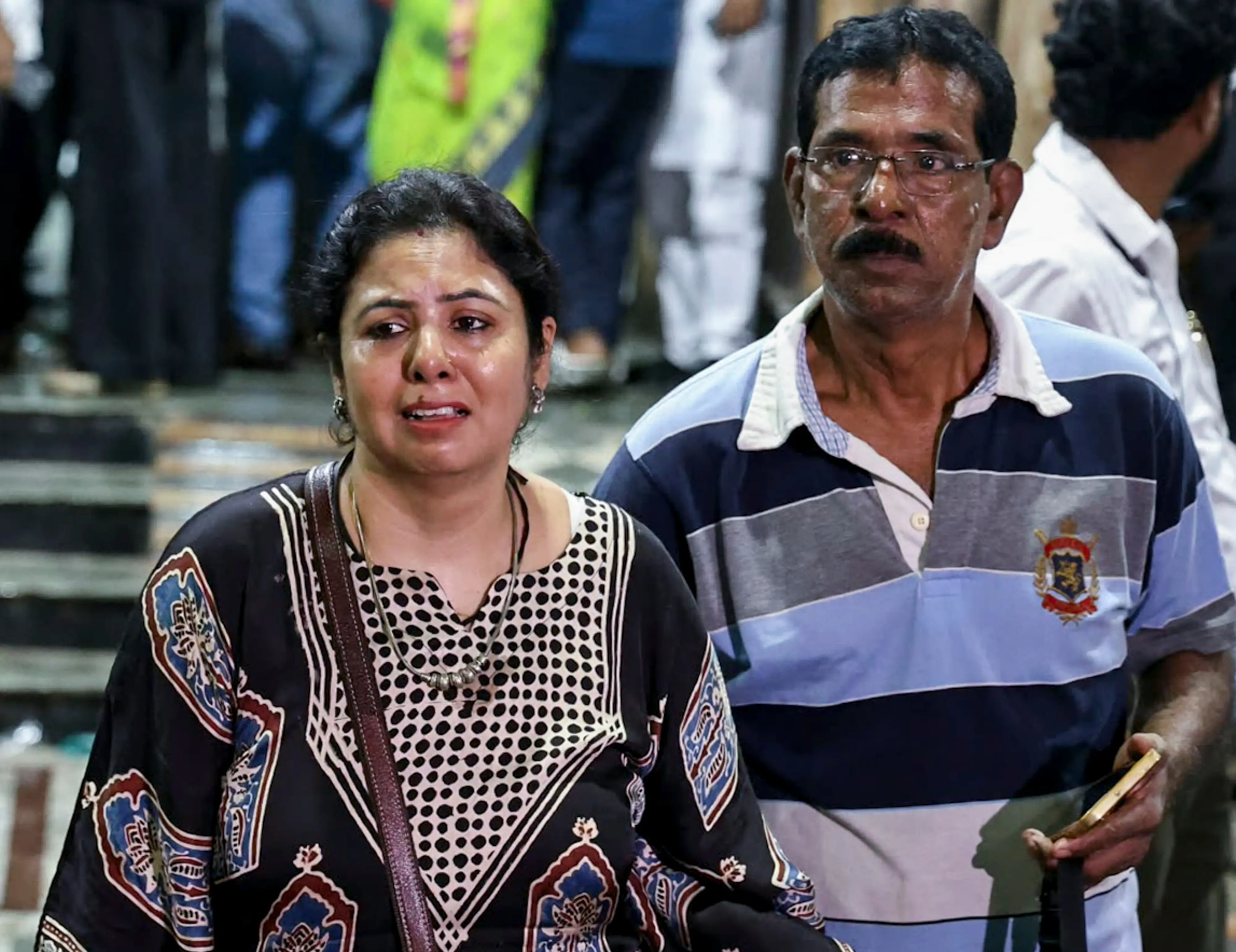 Distraught relatives of a person injured in the stampede at the Chorbagan Sarbojanin Durga Puja pandal, arrive at Kolkata Medical College and Hospital on Saturday, Oct 17, 2026 | Photo: PTI