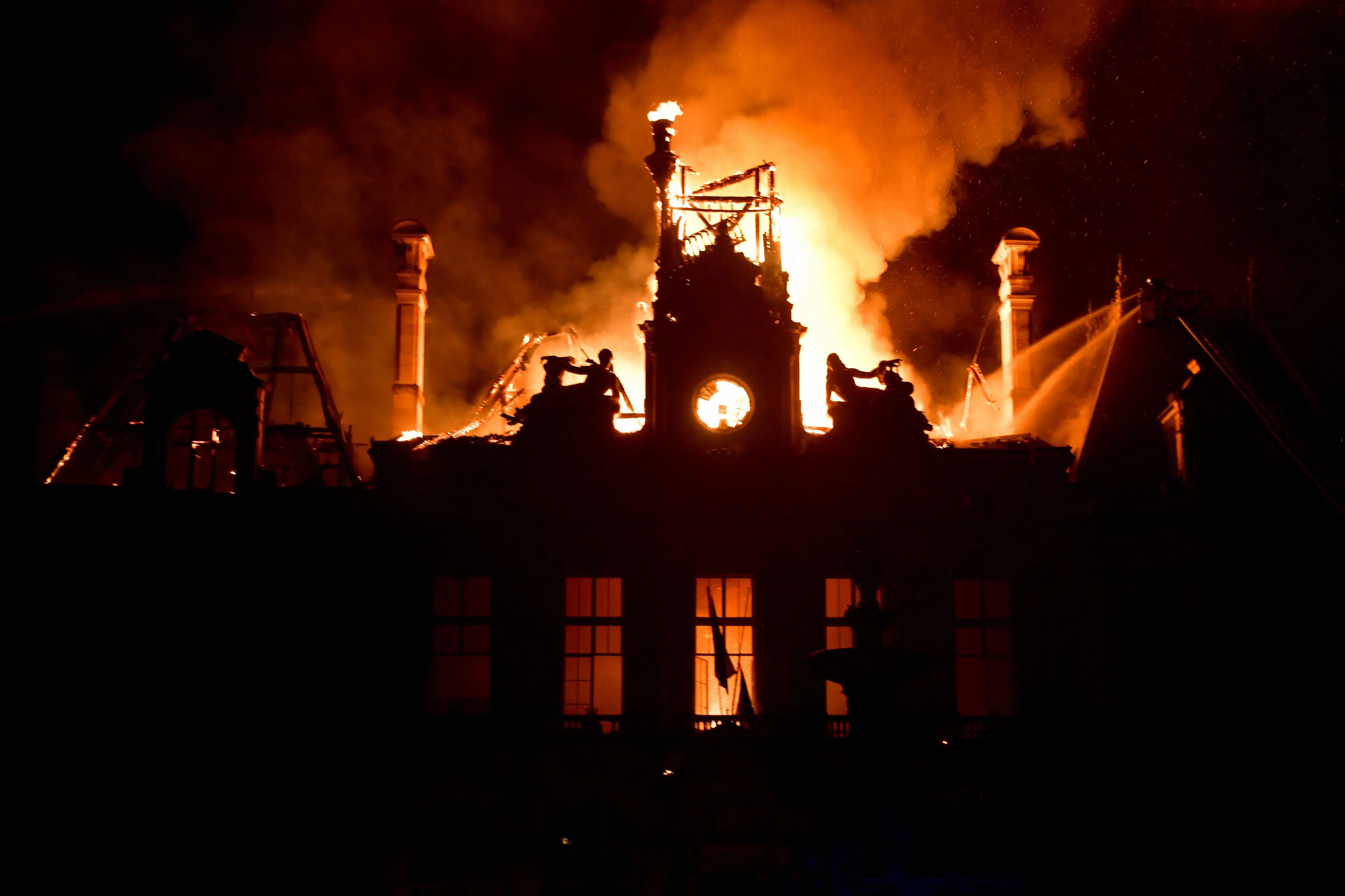 This photograph shows a fire burning and destroying the city hall after a group of individuals forced entry into the building during ongoing protest action against the "high cost of living", in Limoges, central France.| Photo: AP/PTI