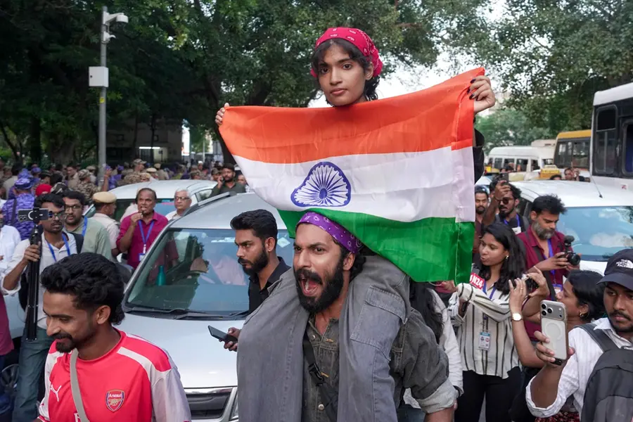People participate in the 'Lehra Do Tiranga' protest march called by called by the Cockroach Janta Party (CJP) demanding the resignation of Chief Election Commissioner (CEC) Gyanesh Kumar over alleged irregularities in the Special Intensive Revision (SIR) of electoral rolls, at Connaught Place, in New Delhi