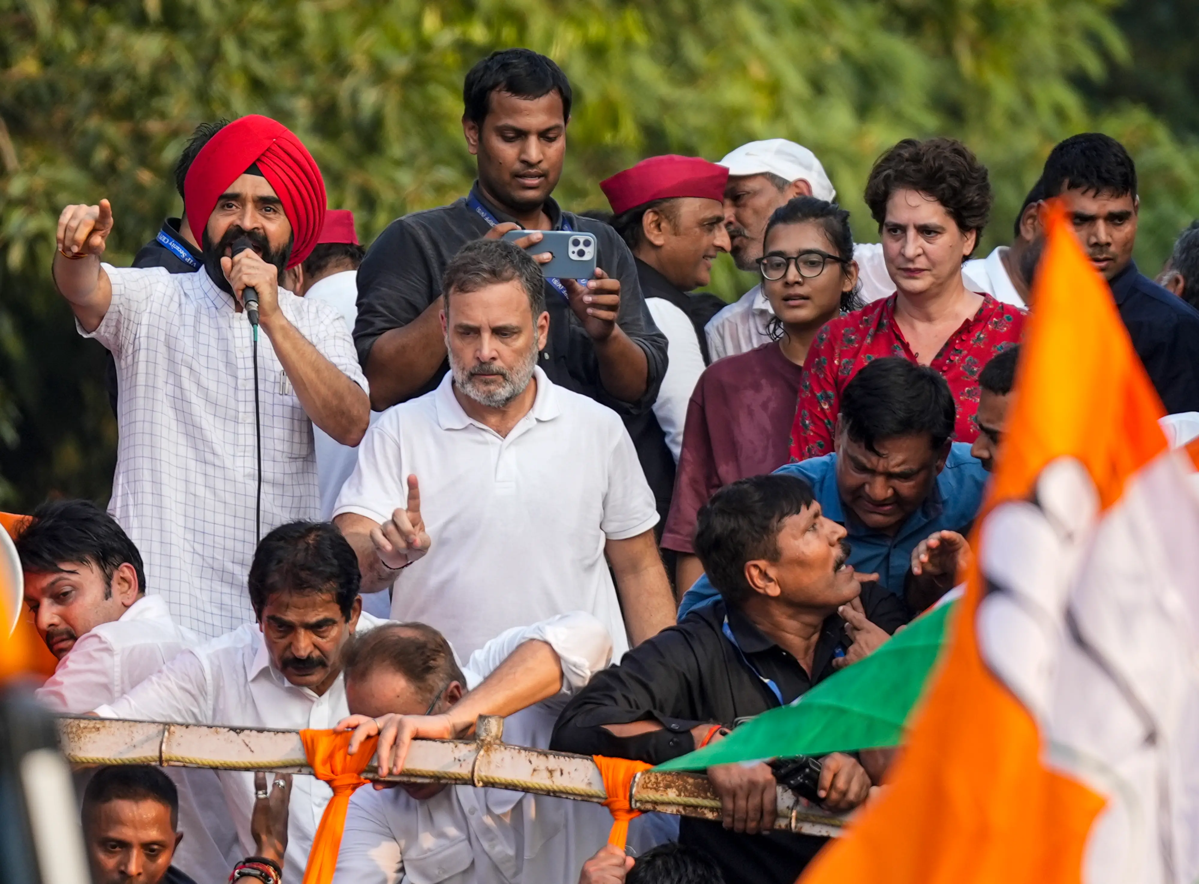 Congress leaders Rahul Gandhi, Priyanka Gandhi Vadra, All India Students' Association (AISA) National President Neha Bora, and others during 'March for Democracy' by INDIA bloc leaders to the Supreme Court, to file a petition against Chief Election Commissioner Gyanesh Kumar and 'vote chori', at Barakhamba road, in New Delhi.| Photo: PTI